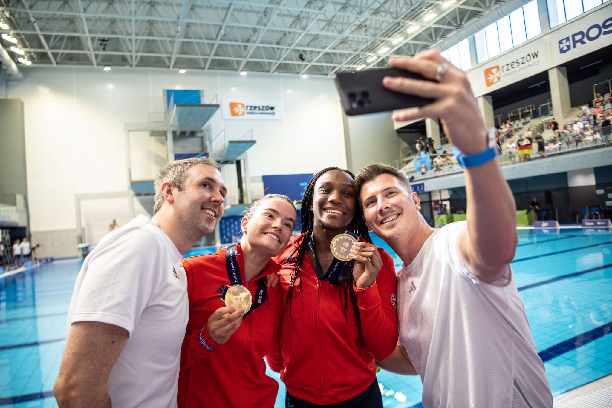Amy Rollinson, second left, and Desharne Bent-Ashmeil, second right, won the women's 3m synchronised springboard diving event ©Kraków-Małopolska 2023