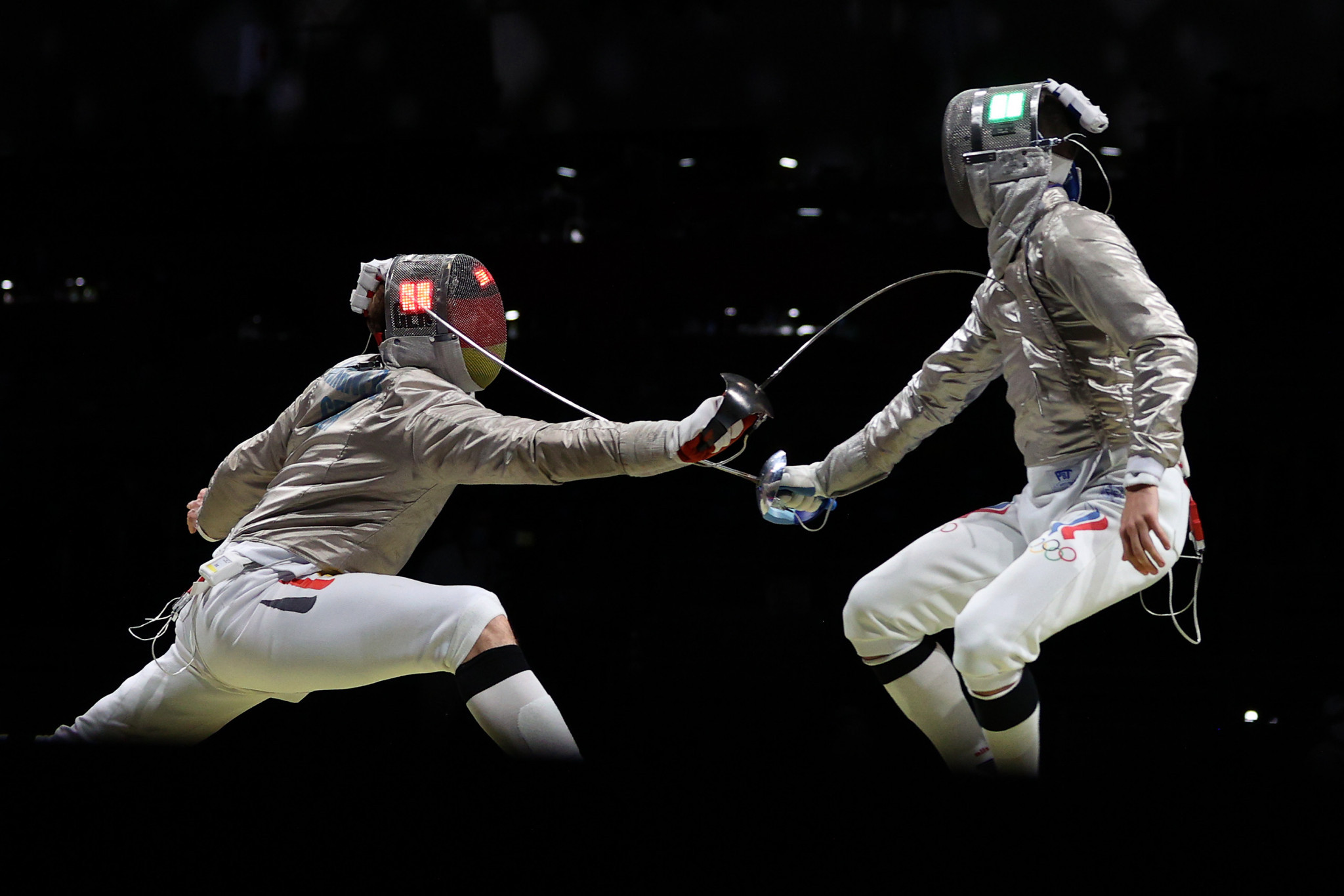 Russian fencer Konstantin Lokhanov, right, is set to compete in the Summer Nationals in Phoenix which begin today after moving to the United States ©Getty Images