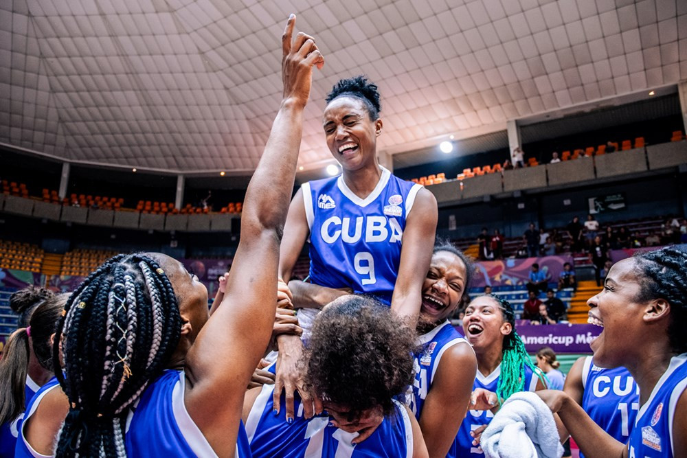 Cuba's top scorer Yamara Amargo was chaired off after her 25 points helped defeat Argentina, but her side's chances of reaching the knockout stages remain in the balance ©FIBA
