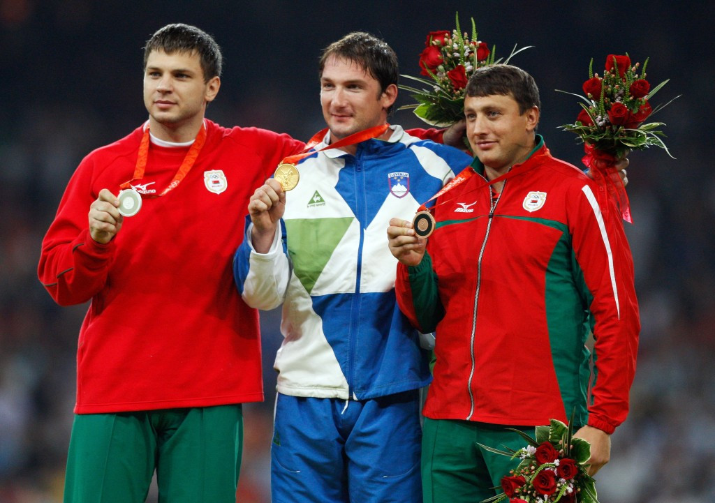 Belarus' Vadim Devyatovskiy celebrates the Olympic silver medal he won at Beijing in 2008 and which he was stripped of briefly before it was returned to him ©Getty Images