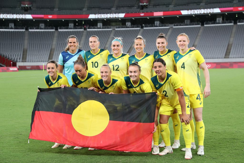 The Australian women's football team pictured at the Tokyo 2020 Games with the Aboriginal flag ©Getty Images