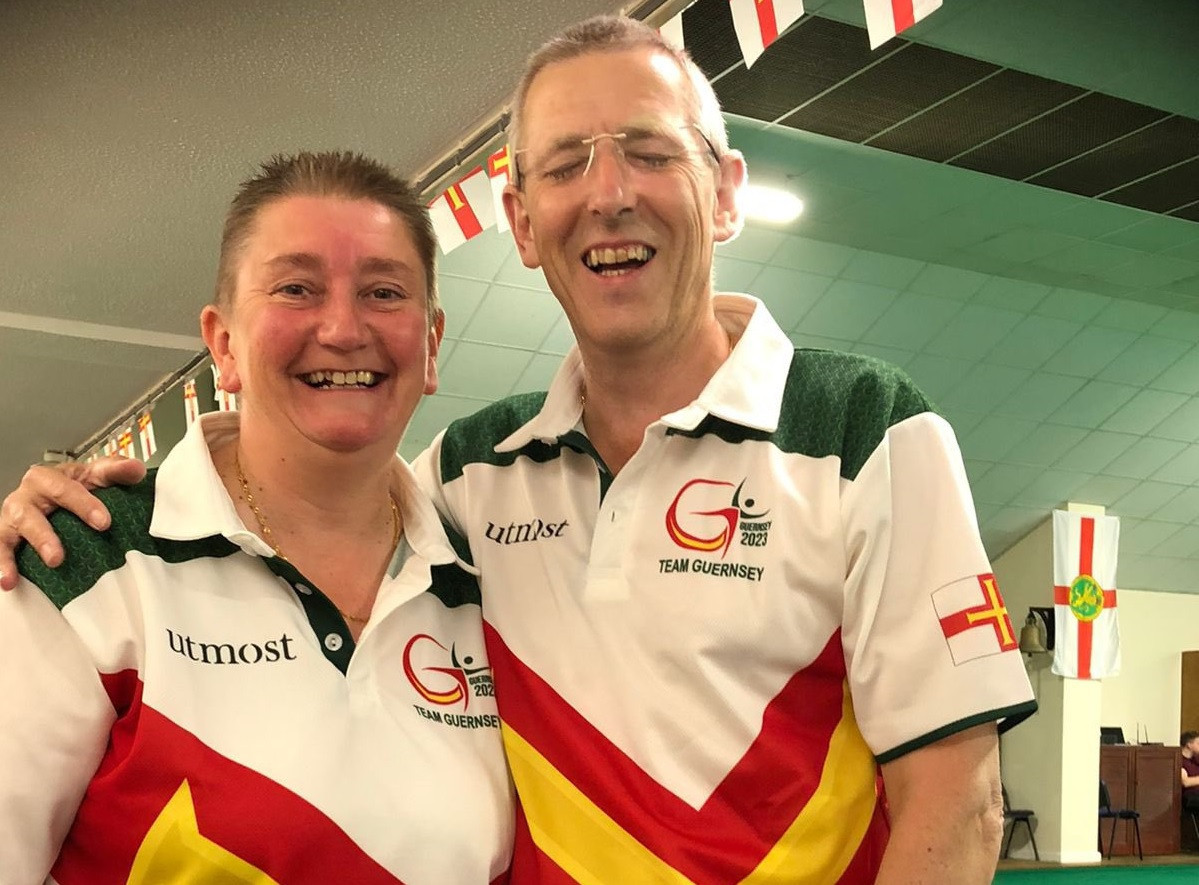Married couple Alison Merrien, left, and Ian Merrien, right, were all smiles after competing in the open singles final in Guernsey ©Guernsey Island Games Association