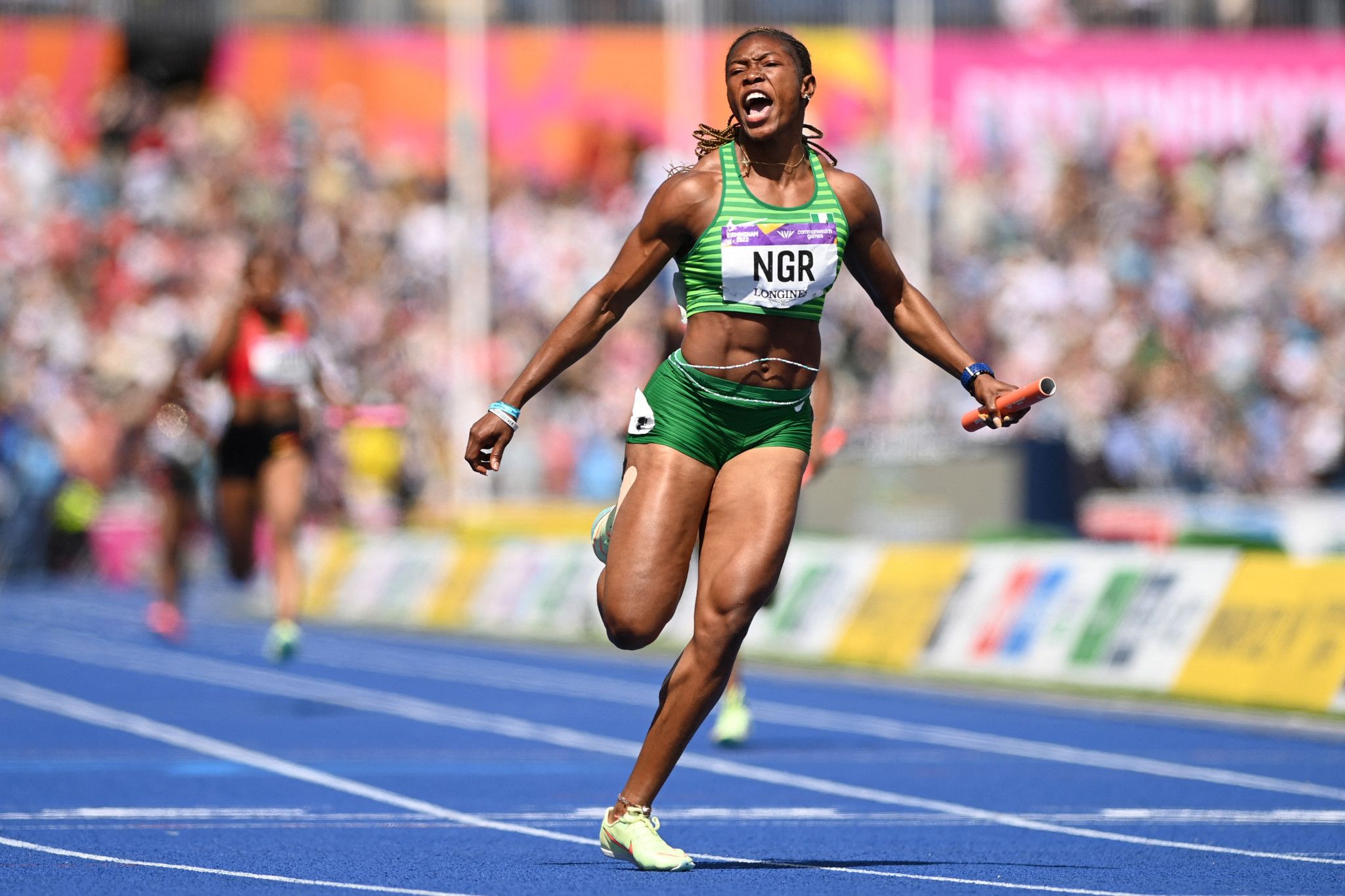 Nigeria's Nzubechi Grace Nwokocha crosses the line to anchor Nigeria to victory in the women's 4x100m relay at Birmingham, but they have now been stripped of the gold after her positive drugs test ©Getty Images
