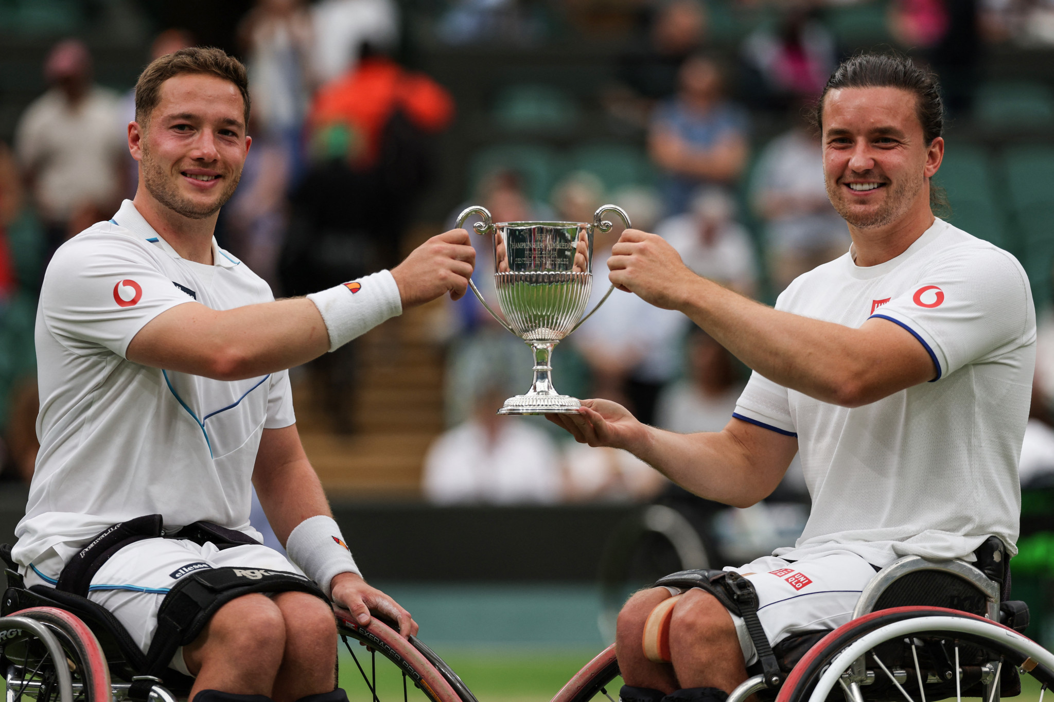 Britain's Alfie Hewett, left, and Gordon Reid pose with the trophy after defeating Japan's Takuya Miki and Tokito Oda ©Getty Images 