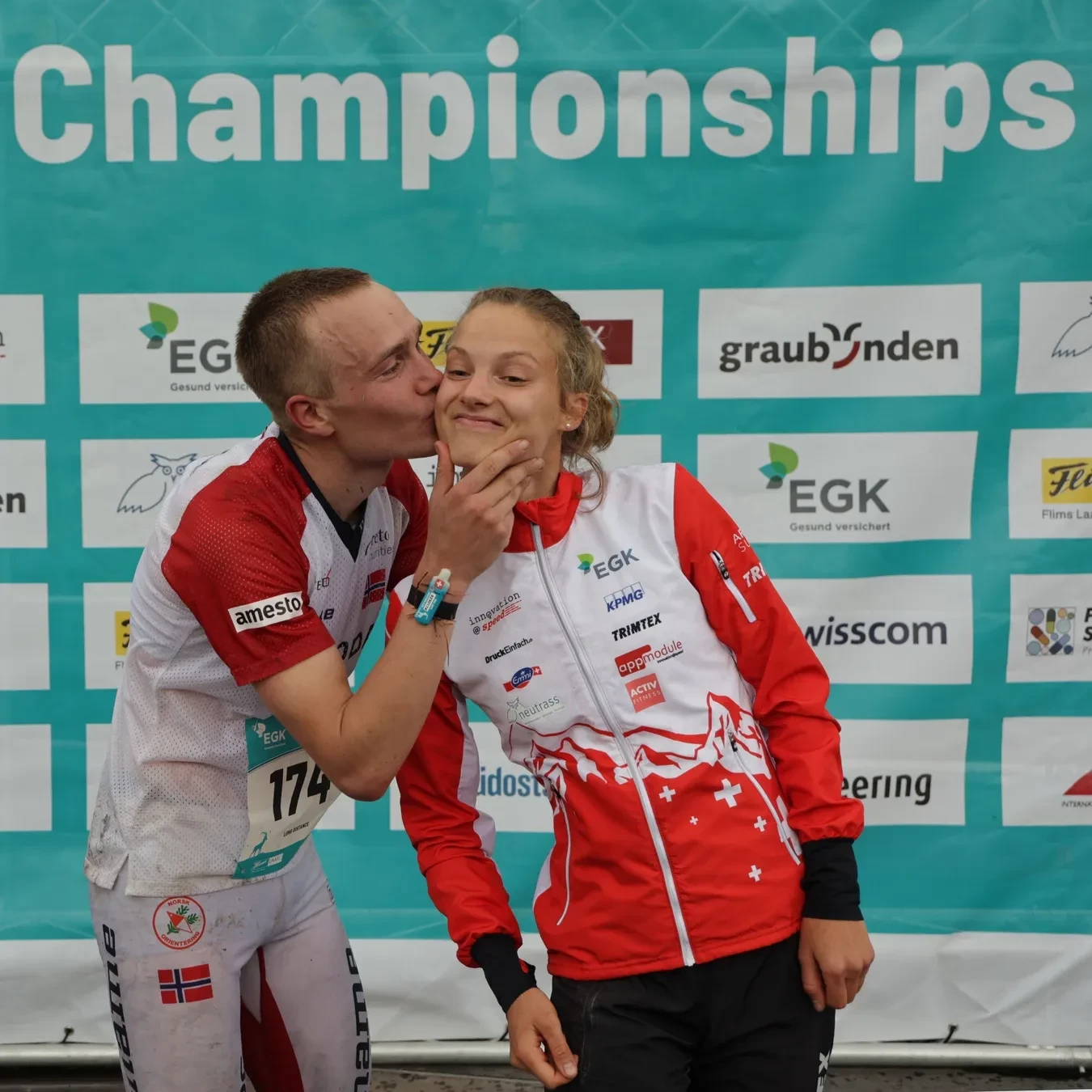 Partners Kasper Harlem Fosser and Simona Aebersold celebrate their gold medals in their respective long distance event©IOF