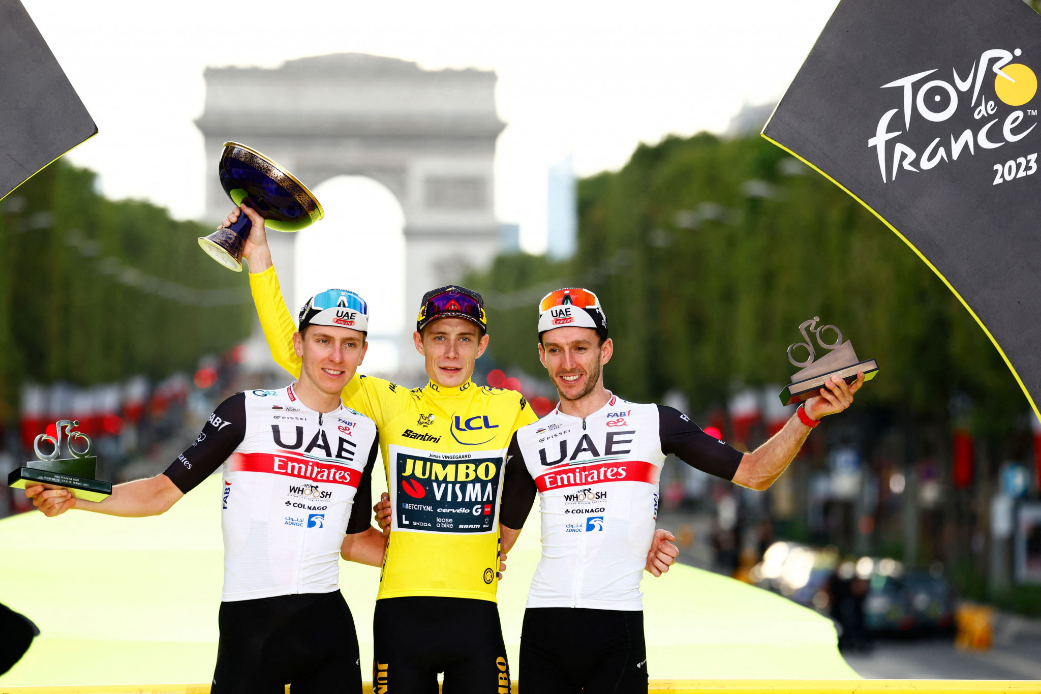 Denmark's Jonas Vingegaard, centre, dominated this year's Tour de France, with Slovenia's Tadej Pogačar, left, his closest challenger in second and another UAE Team Emirates rider in Britain's Adam Yates, right, finishing third ©Getty Images