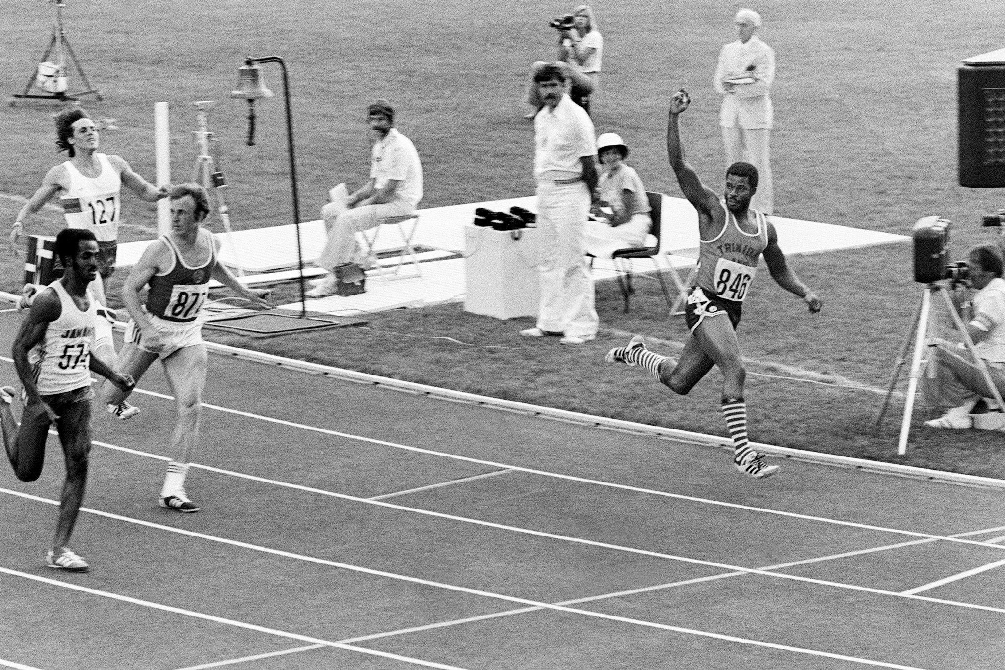Hasely Crawford salutes as he crosses the line to win the 100 metres final at Montreal 1976 to become Trinidad and Tobago's first Olympic gold medallist ©Getty Images