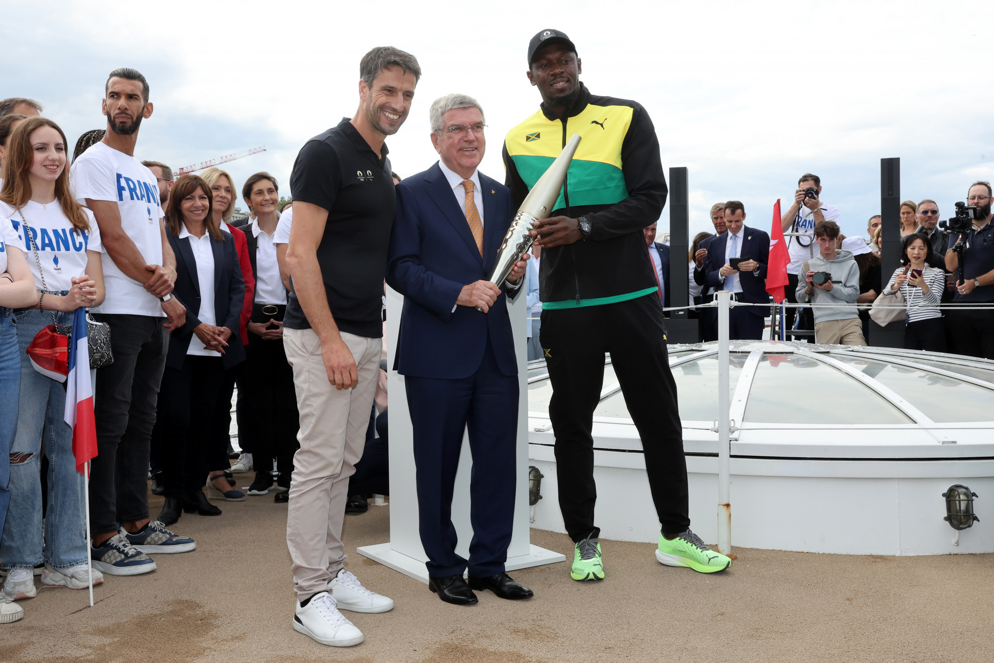 Bolt is surprise guest as newly unveiled Paris 2024 Olympic Torch parades on River Seine