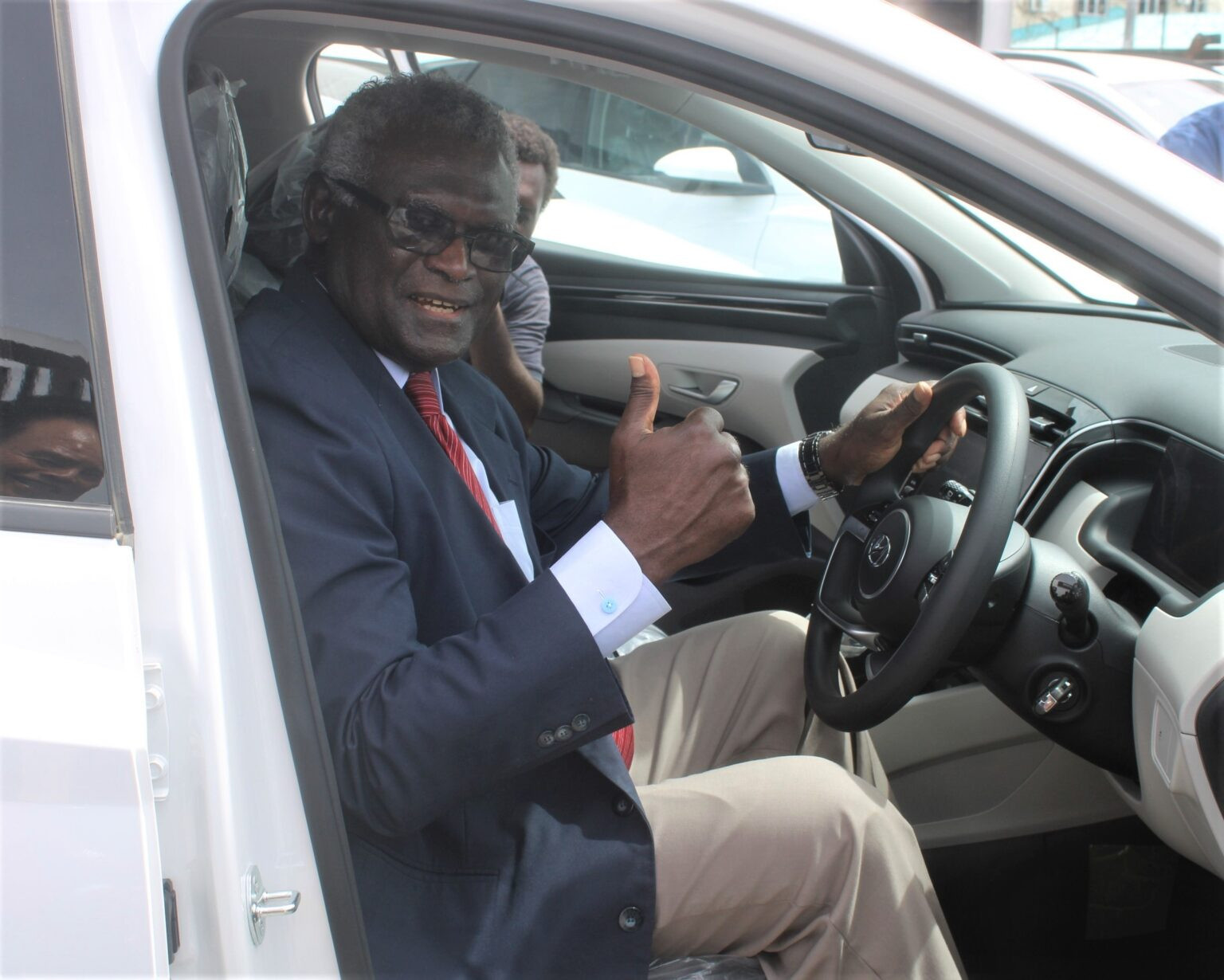Solomon Islands Prime Minister Manesseh Sogavare receives the first 14 vehicles from South Korea to help the 2023 Pacific Games ©Solomon Islands Prime Ministers Office