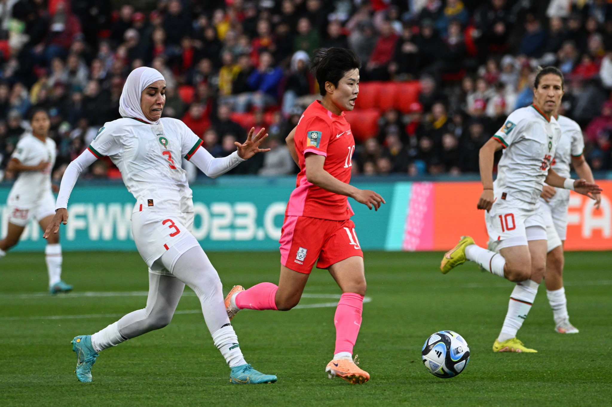 Headscarf-wearing Nouhaila Benzina, left, helped Morocco beat South Korea 1-0 ©Getty Images