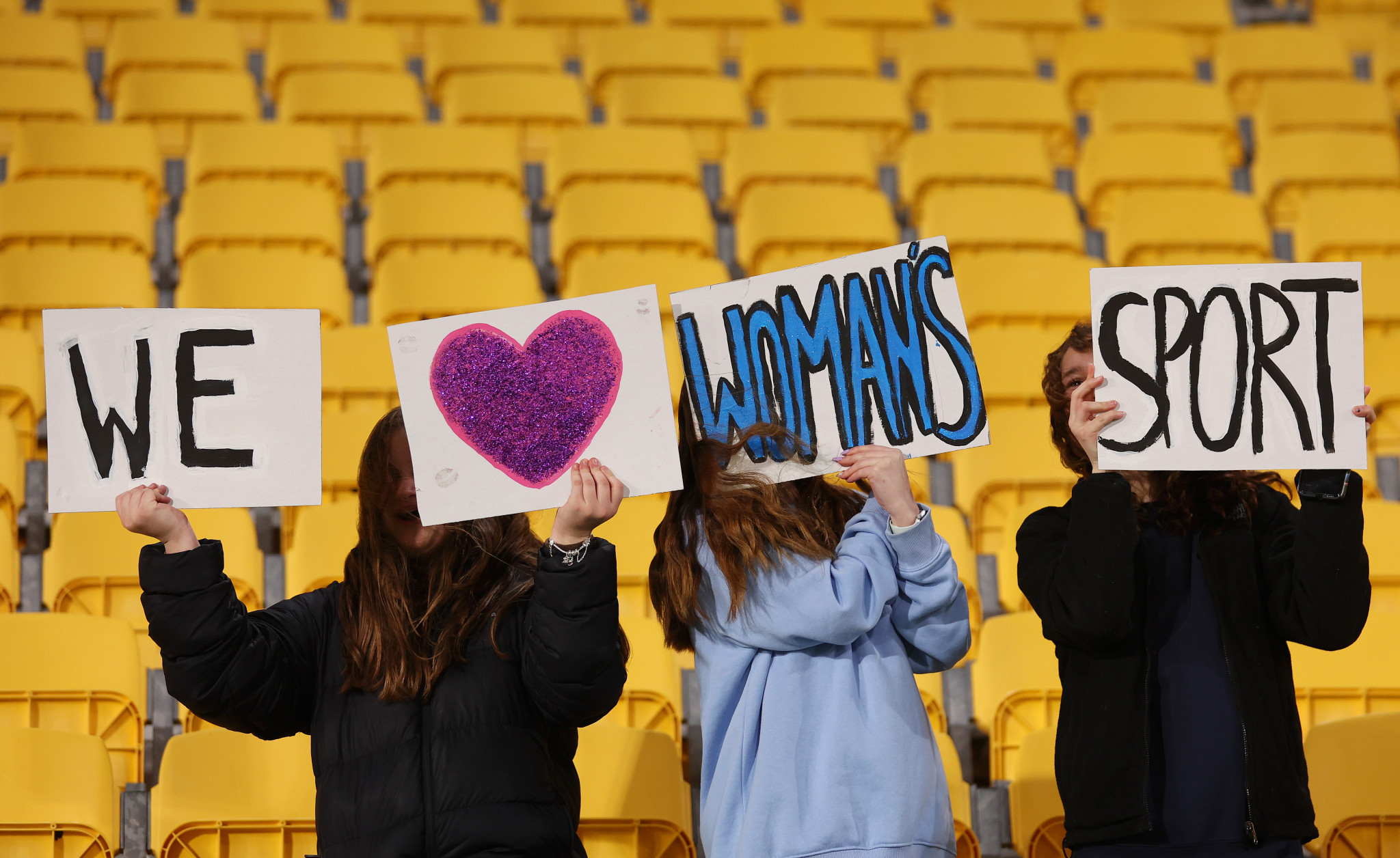 Fans hold a banner promoting women's sport prior to the Japan-Spain match in Wellington ©Getty Images