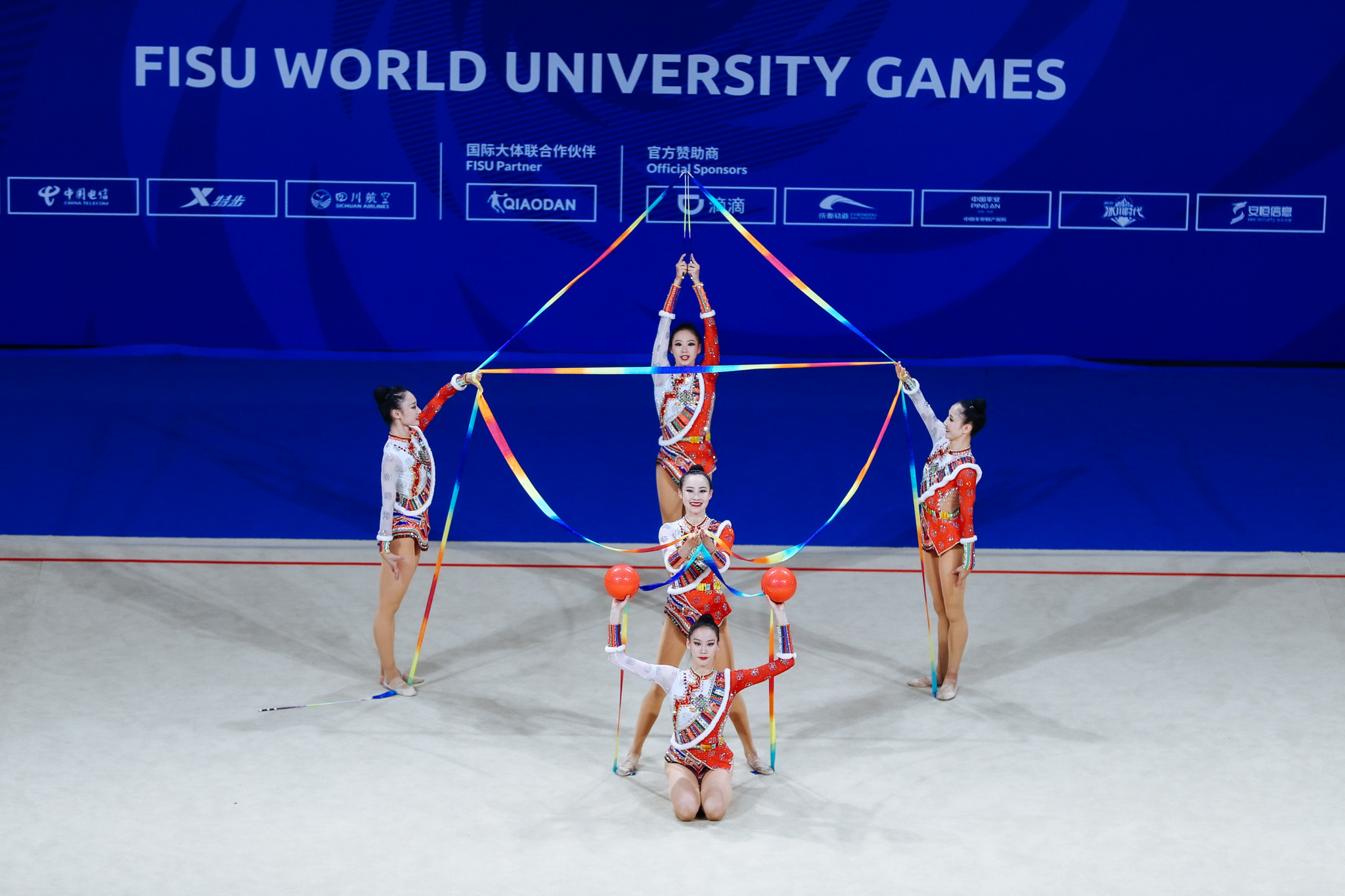 China's team on their way to three ribbons and two balls group silver in rhythmic gymnastics ©FISU 