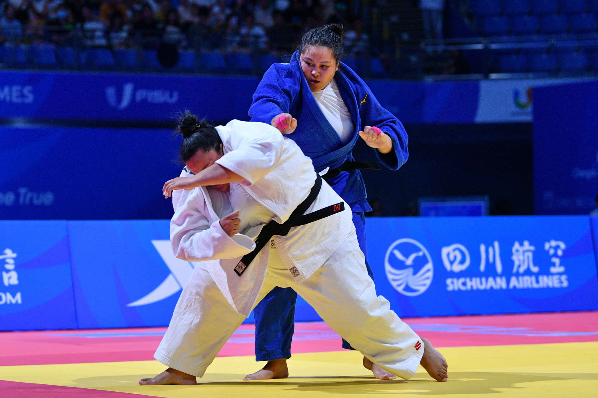 Agatha Martins Silva, in white, of Brazil and Akerke Ramazanova of Kazakhstan in action in the women’s judo +78 kilograms bronze medal match ©Chengdu 2021