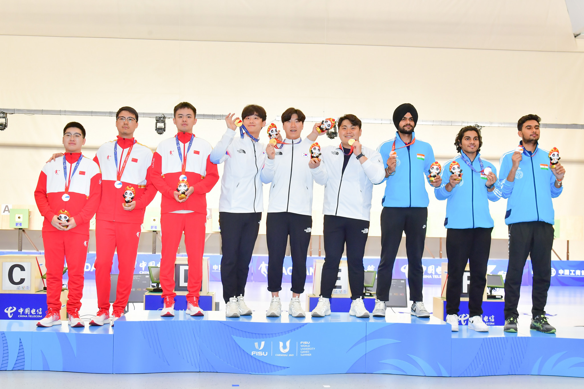 South Korea, centre, won the men's 10m air pistol shooting gold medal ©FISU