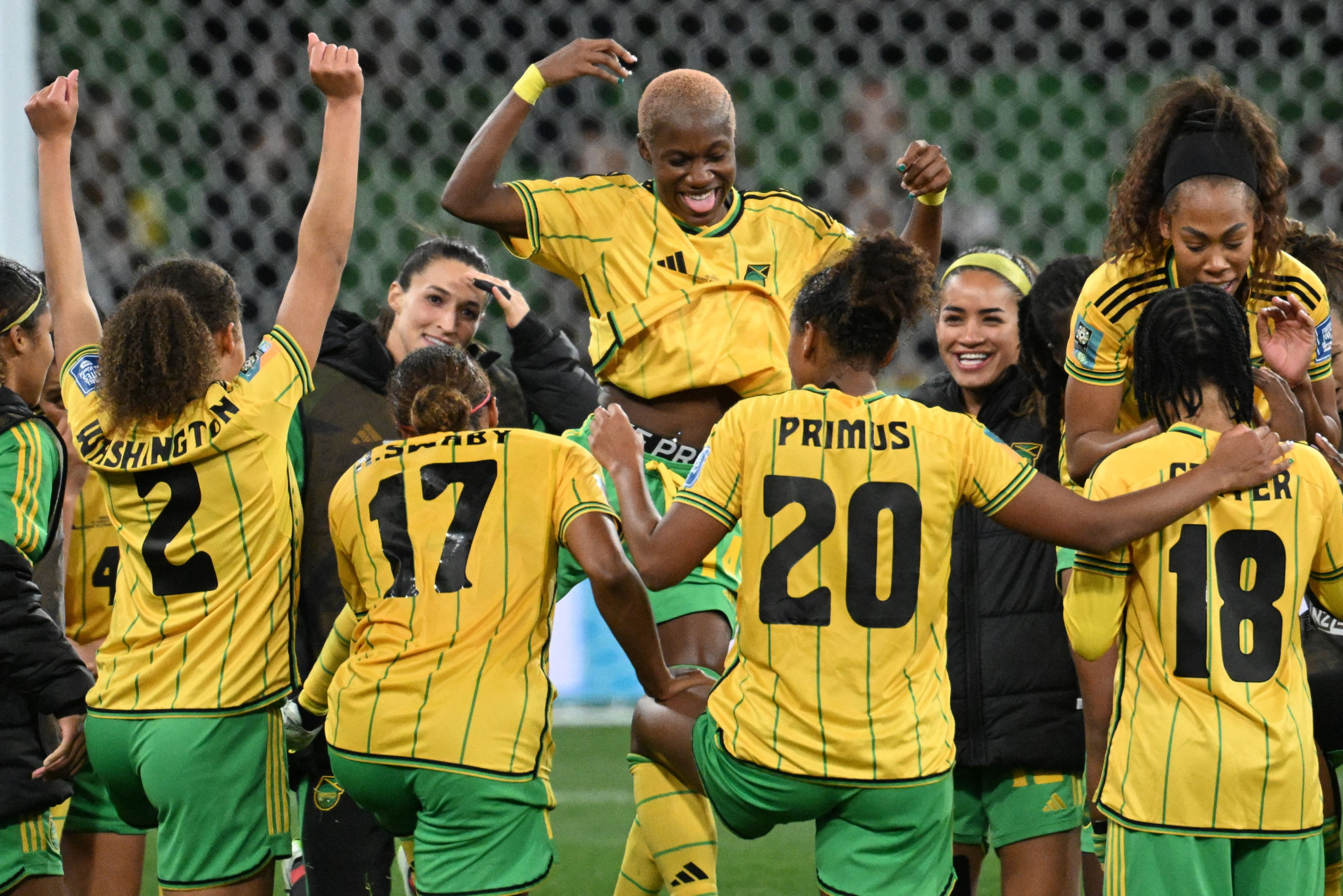 Jamaica's players celebrate after advancing to the last 16 following a 0-0 draw with Brazil ©Getty Images
