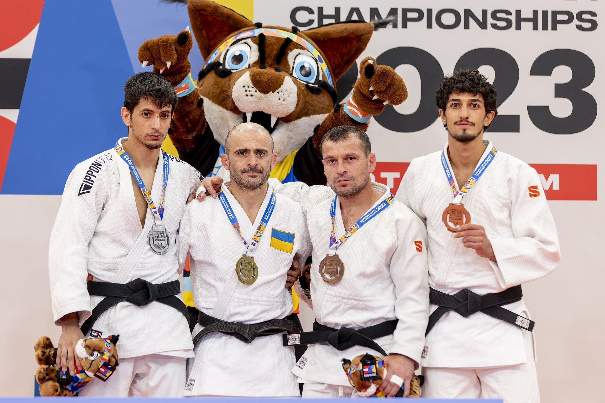 Davyd Khorava, second from right, stood at the top of the podium on a great first day for Ukraine ©EPC