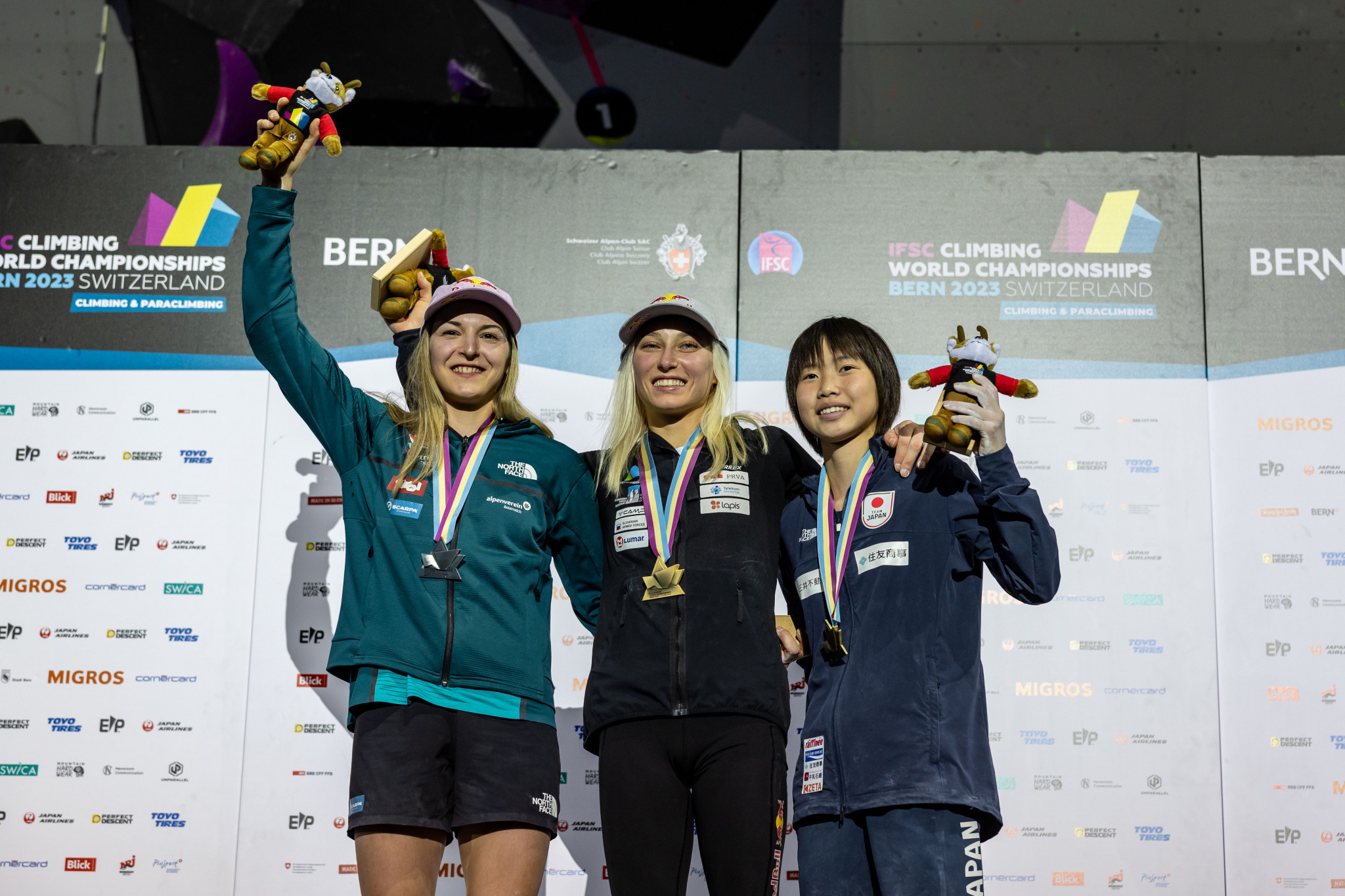 Olympic champion Janja Garnbret of Slovenia, centre, won the boulder and lead title today ©IFSC