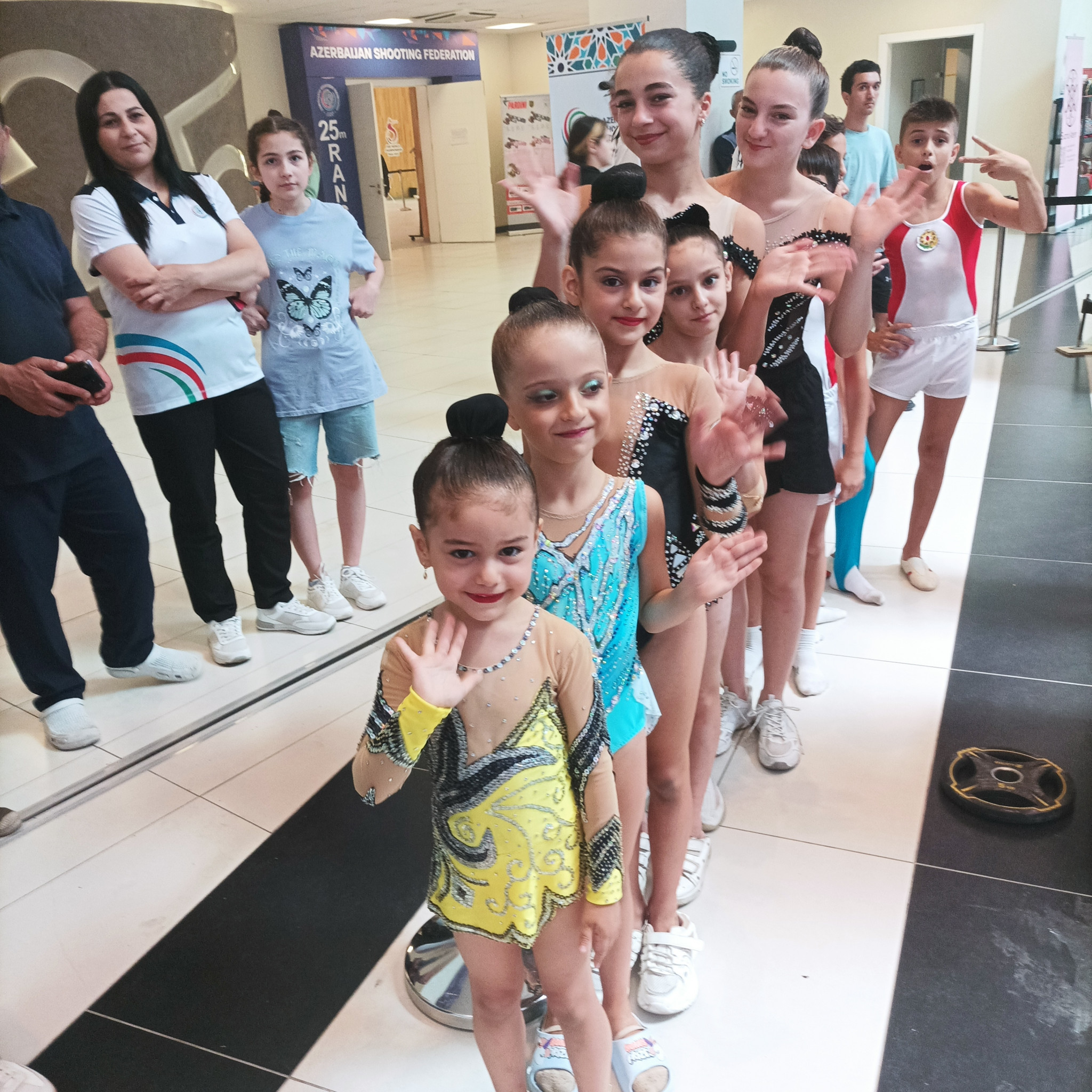 A group of gymnasts are ready to perform for visitors at the ISSF World Shooting Championships ©ITG