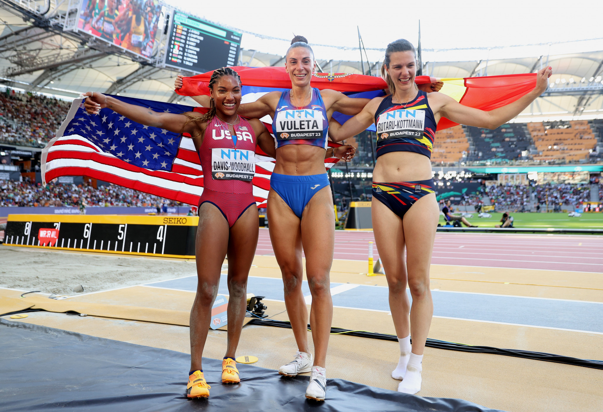 Ivana Vuleta of Serbia, centre, clinched women's long jump gold ahead of Tara Davis-Woodhall of the US, left, and Romania's Alina Rotaru-Kottmann, right ©Getty Images