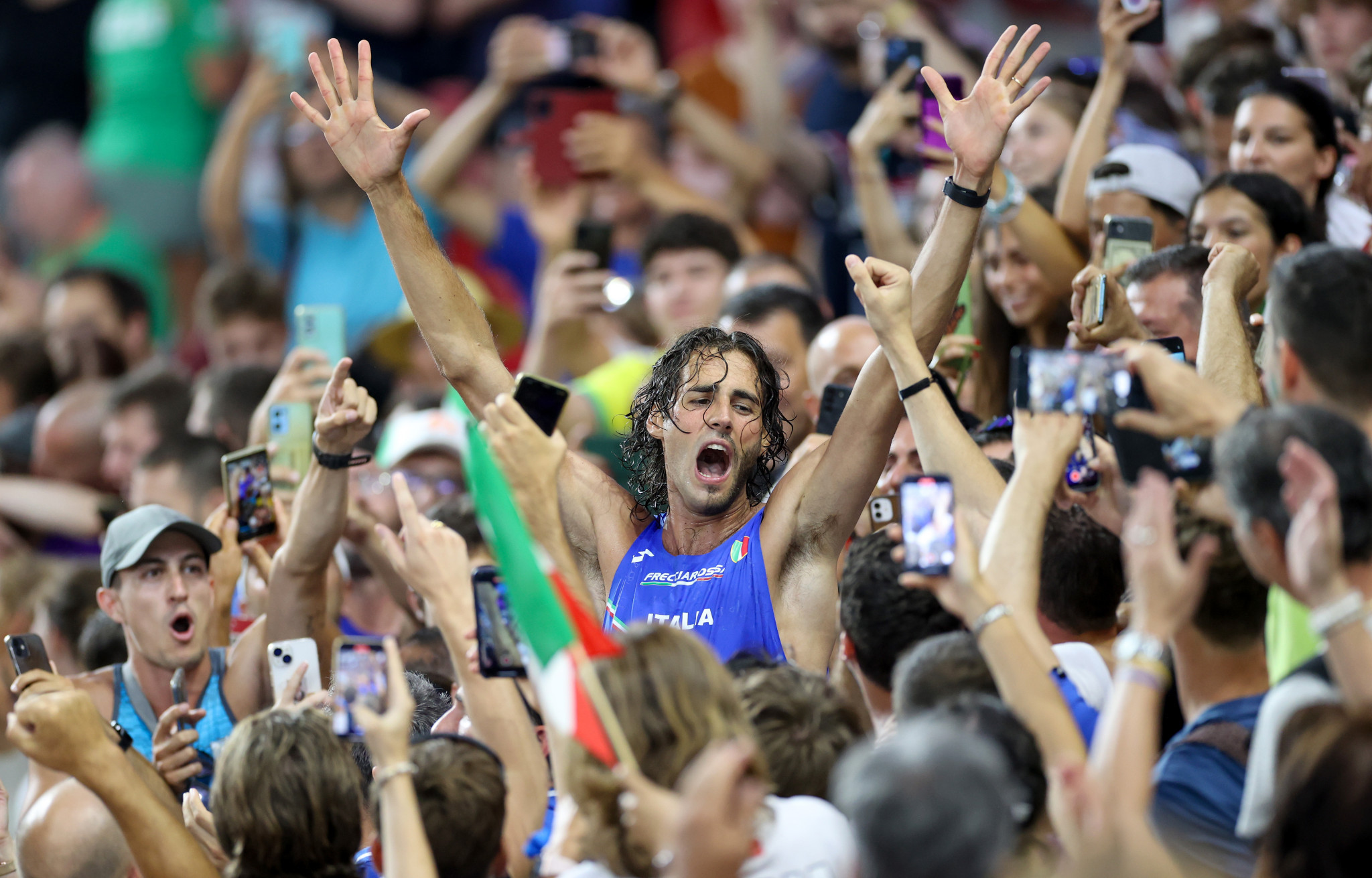 Gianmarco Tamberi of Italy, centre, was in celebratory mood after his men's high jump triumph ©Getty Images