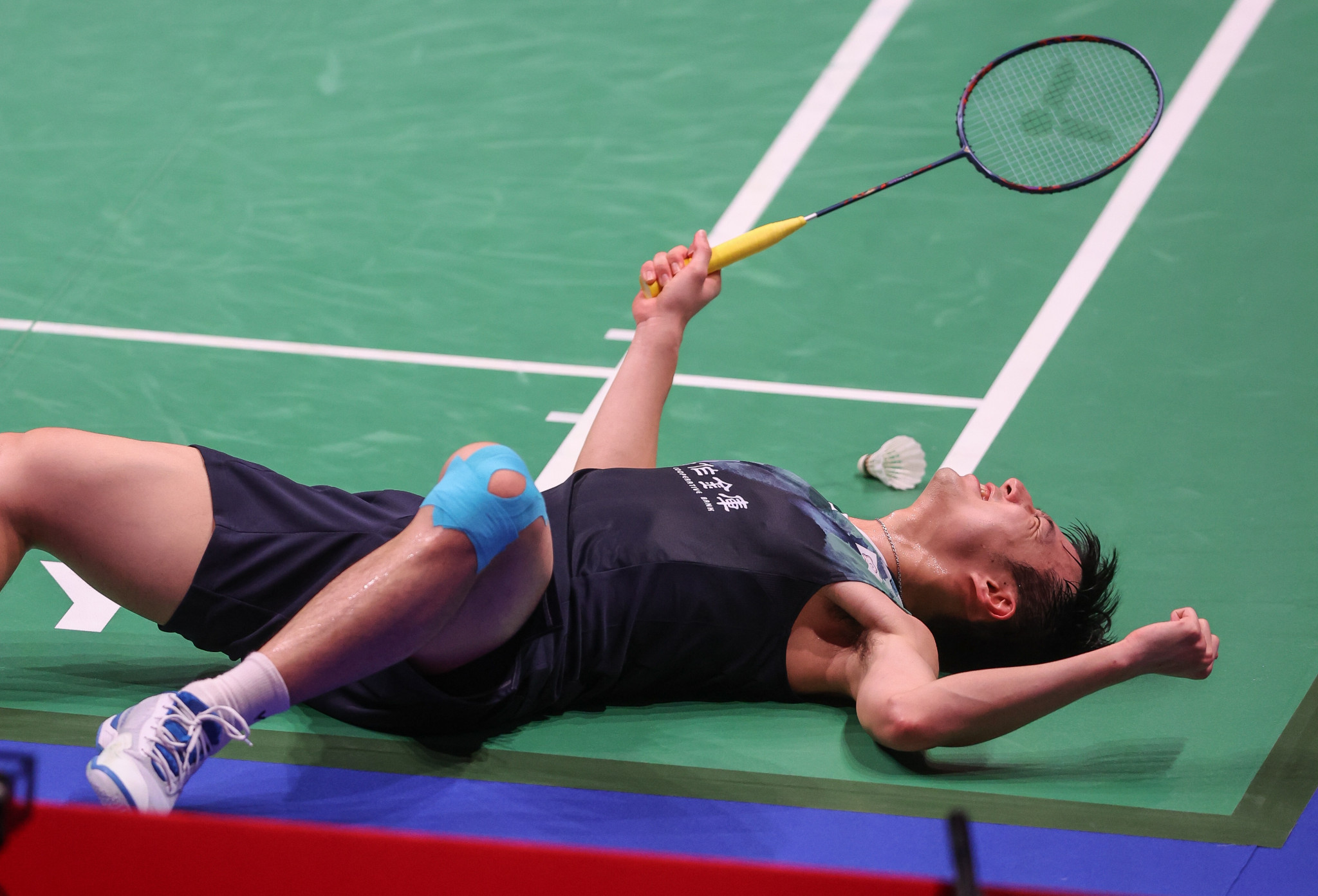 Unseeded Wang upsets Li to reach quarter-finals at BWF World Championships