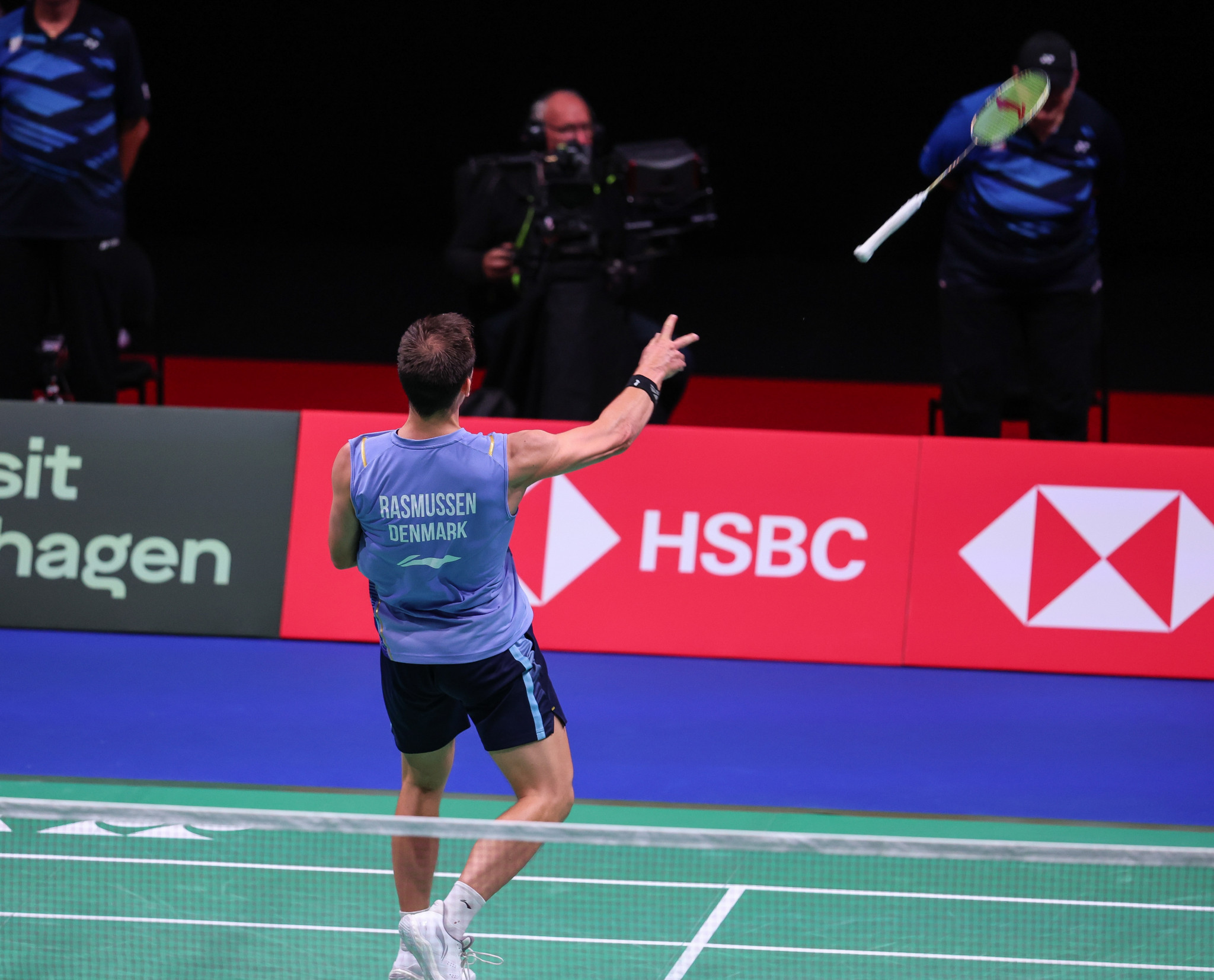 Anders Skaarup Rasmussen throws his racket into the home crowd in celebration after he and his doubles partner Kim Astrup stunned India's Satwiksairaj Rankireddy and Chirag Shetty ©Badmintonphoto