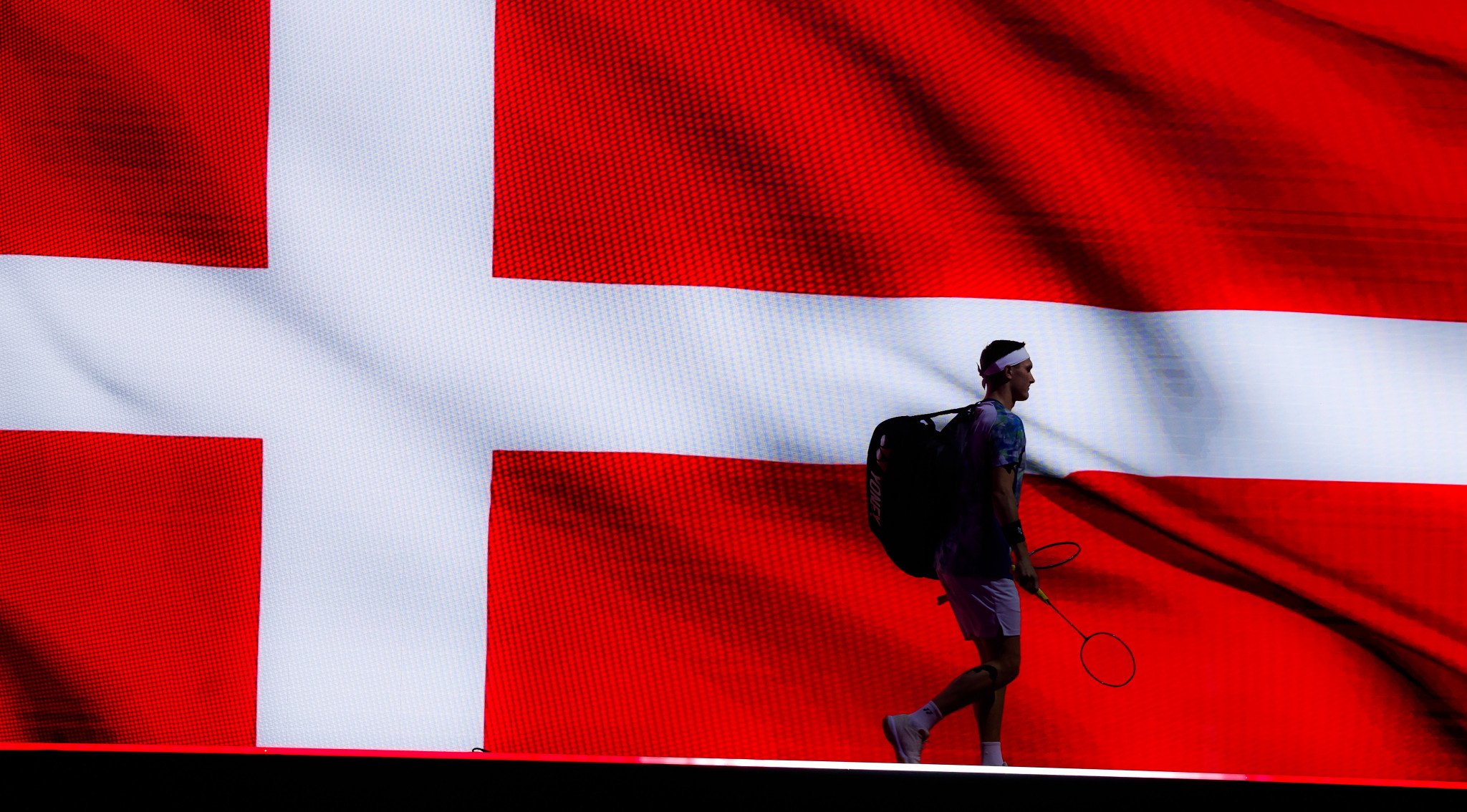 Reigning Olympic and world champion Viktor Axelsen of Denmark leaves the stage after his surprise loss in the quarter-finals  ©Badmintonphoto