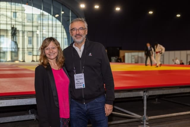 Larisa Kiss, head of international relations for the IJF, with Paris 2024 director general Etienne Thobois at the Grand Palais Éphémère ©IJF