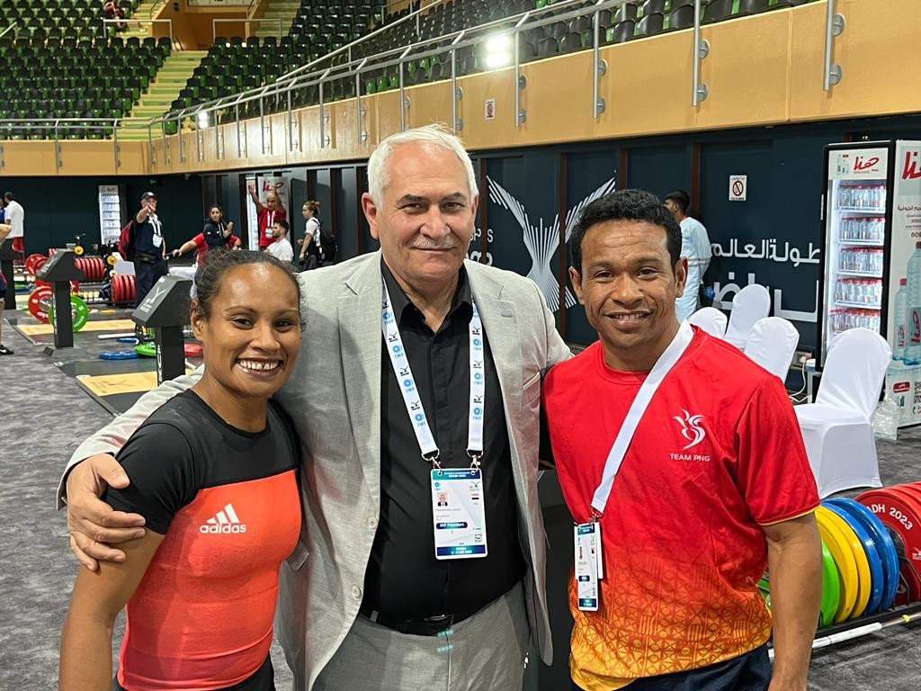 Dika Toua and Morea Baru of Papua New Guinea pictured with IWF President Mohammed Jalood ©IWF
