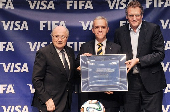 Sepp Blatter (left) pictured with Visa official when extending FIFA's support until 2022 last year ©Visa