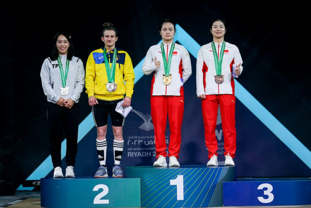 The podium for the women's 59 kilograms final ©IWF