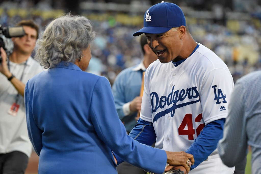 JRF founder Rachel Robinson is greeted by Los Angeles Dodgers manager Dave Roberts during a ceremony honouring Jackie Robinson