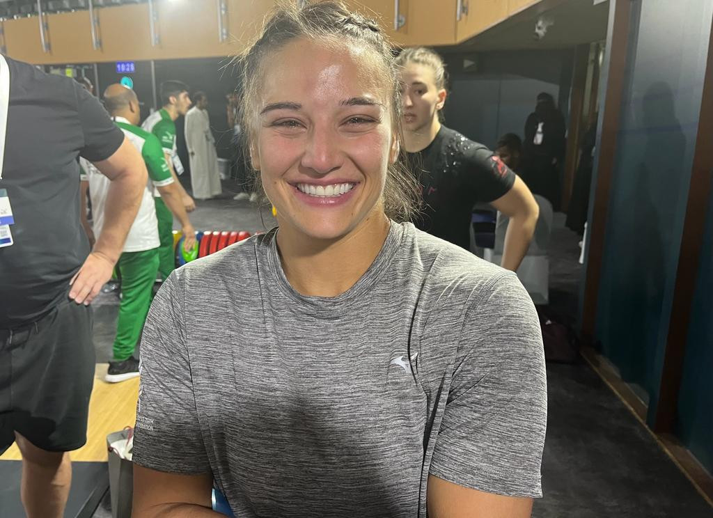 Celia Gold manages a smile despite fearing she had seriously injured her elbow after missing her final attempt in the women's 71kg C Group ©IWF