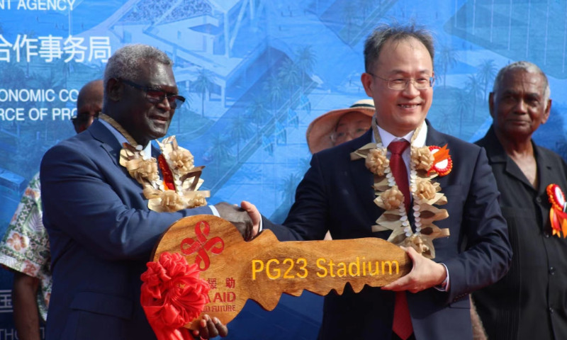 Solomon Islands Prime Minister Manasseh Sogavare, left, received the ceremonial key to the Pacific Games main stadium from Chinese Ambassador Li Ming, right ©Chinese Embassy in the Solomon Islands