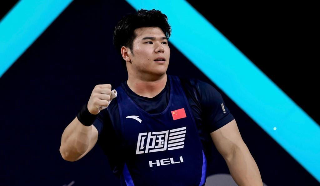 Liu Huanhua of China celebrates his victory following the men's 102kg final ©IWF