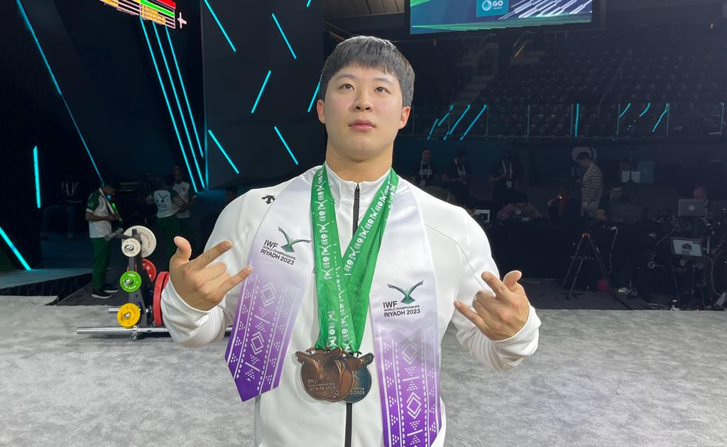 Jang Yeonhak of South Korea with his medals after a phenomenal effort in the men's 102kg B group ©ITG