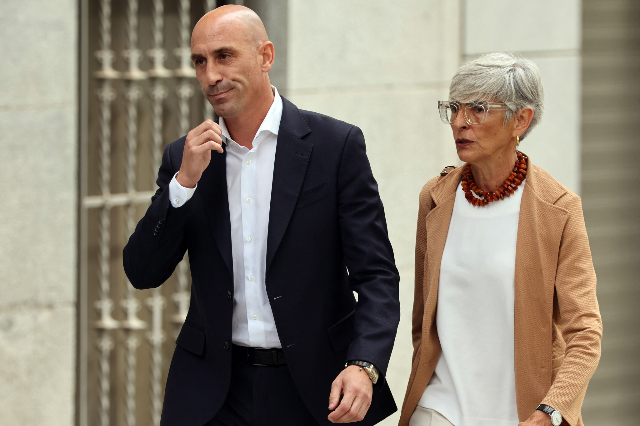 Luis Rubiales, left, leaves the court in Madrid with his lawyer Olga Tubau after appearing in front of a judge for the first time ©Getty Images 