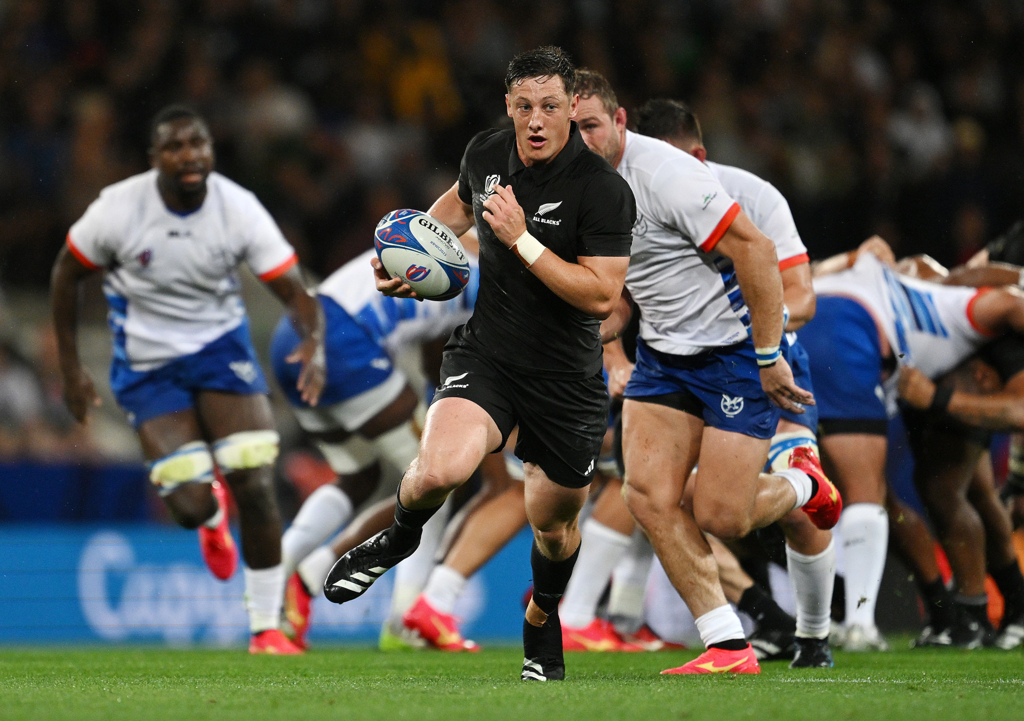 Cam Roigard, centre, scored first for New Zealand as they demolished Namibia ©Getty Images