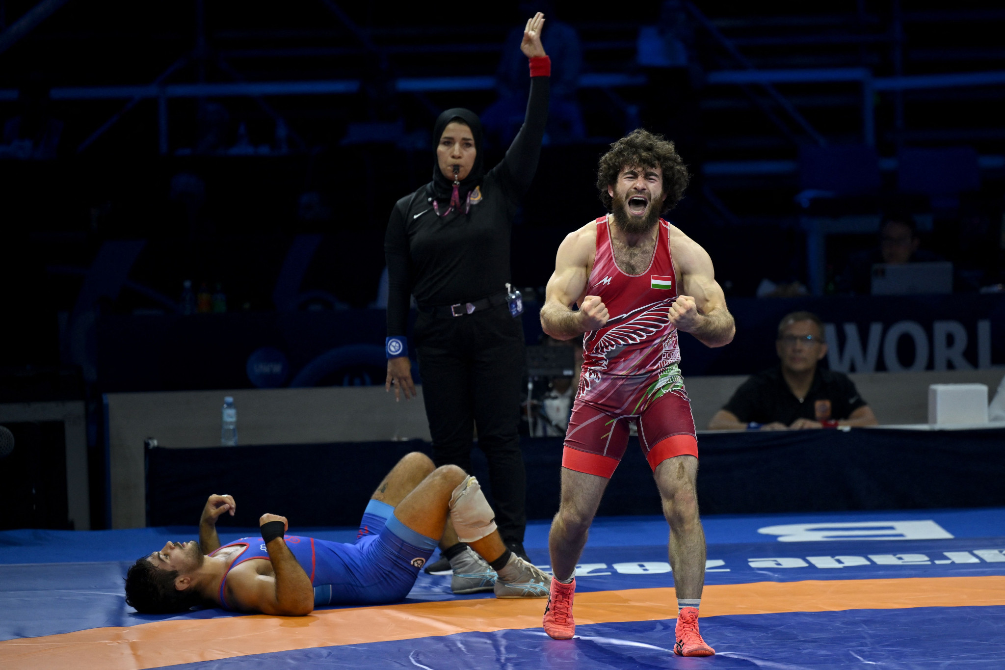 Ismail Musukaev of Hungary, right, overcame Puerto Rico's Sebastian Rivera, left, for men's freestyle 65kg gold ©Getty Images