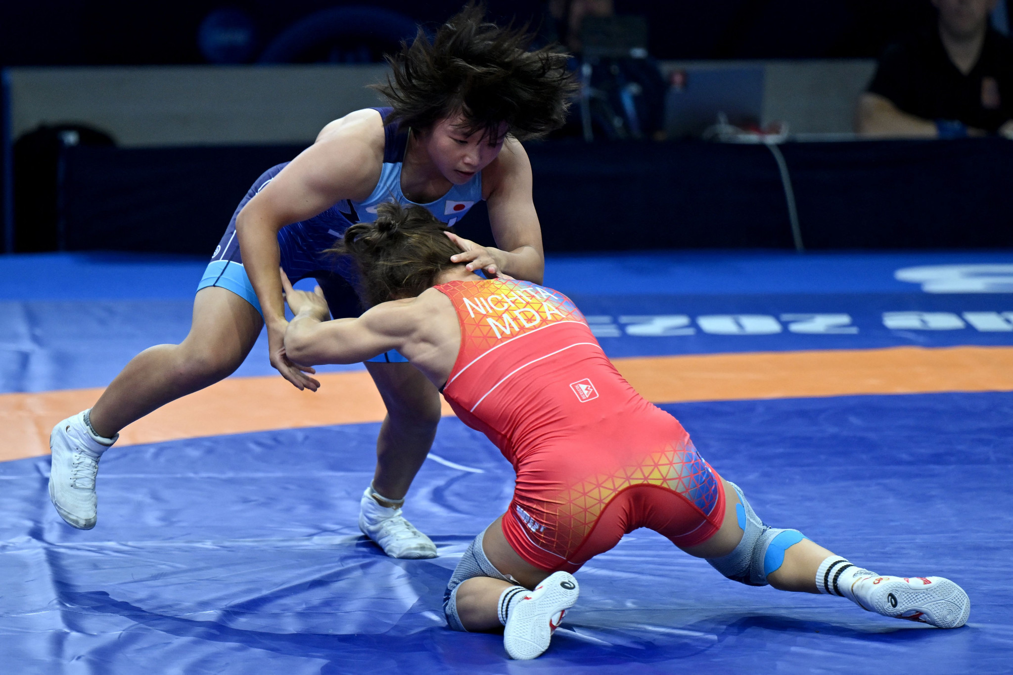 Tsugumi Sakurai of Japan, left, won gold for the third consecutive World Championships by edging the women's 57kg final against Anastasia Nichita of Moldova, right ©Getty Images