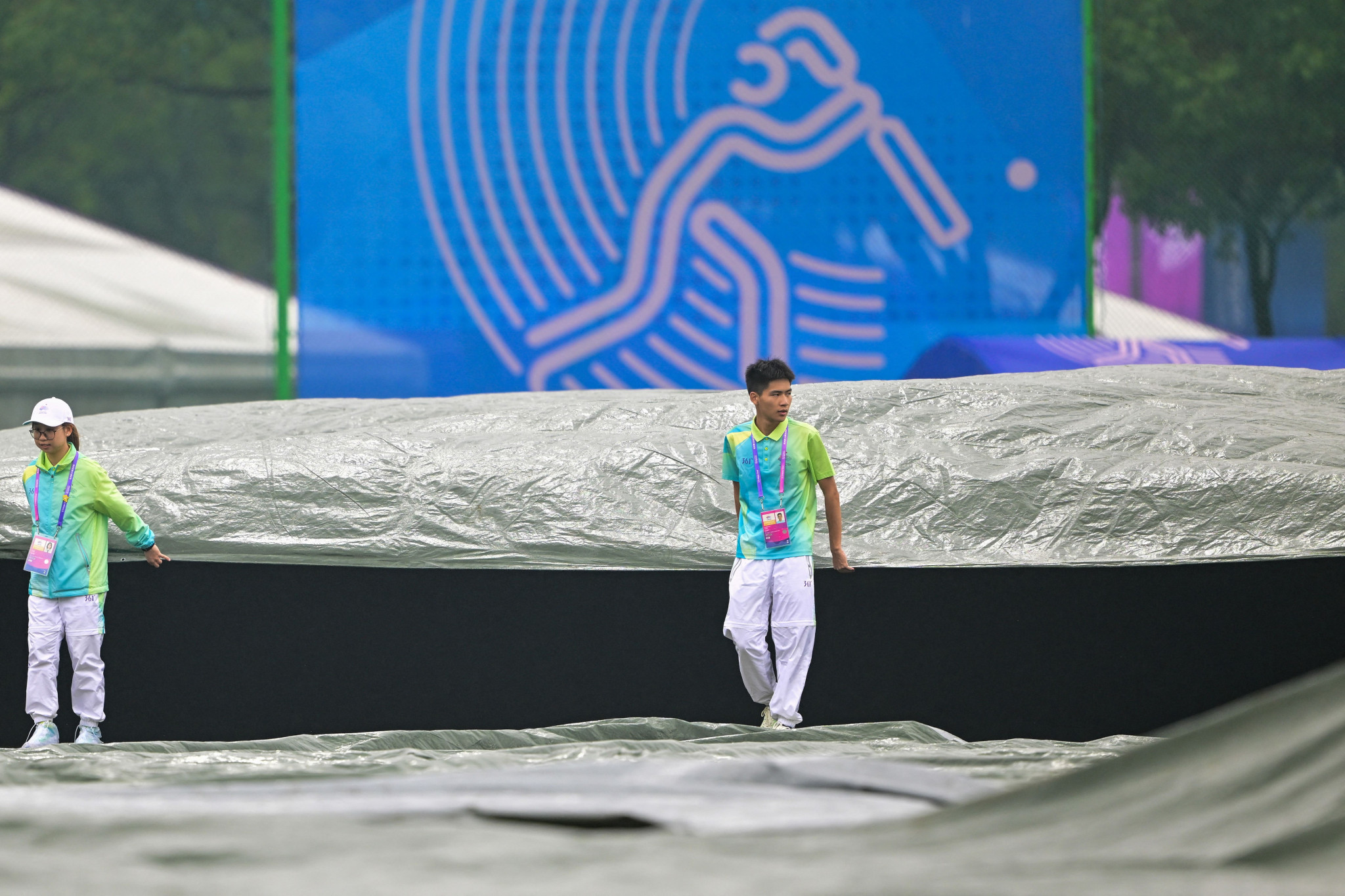 The covers come on as the match between Bangladesh and Hong Kong was abandoned due to bad weather ©Getty Images