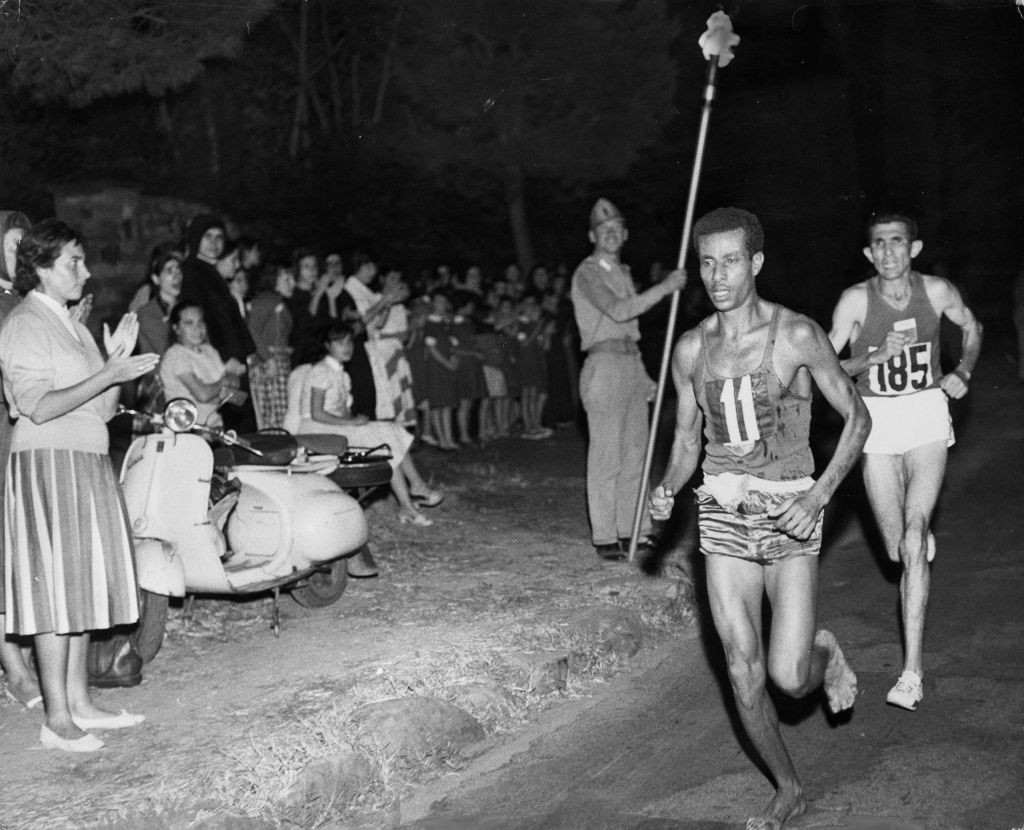 Ethiopia's barefoot Abebe Bikila moves clear en route to winning the first of his two Olympic marathon titles at the Rome 1960 Games ©Getty Images