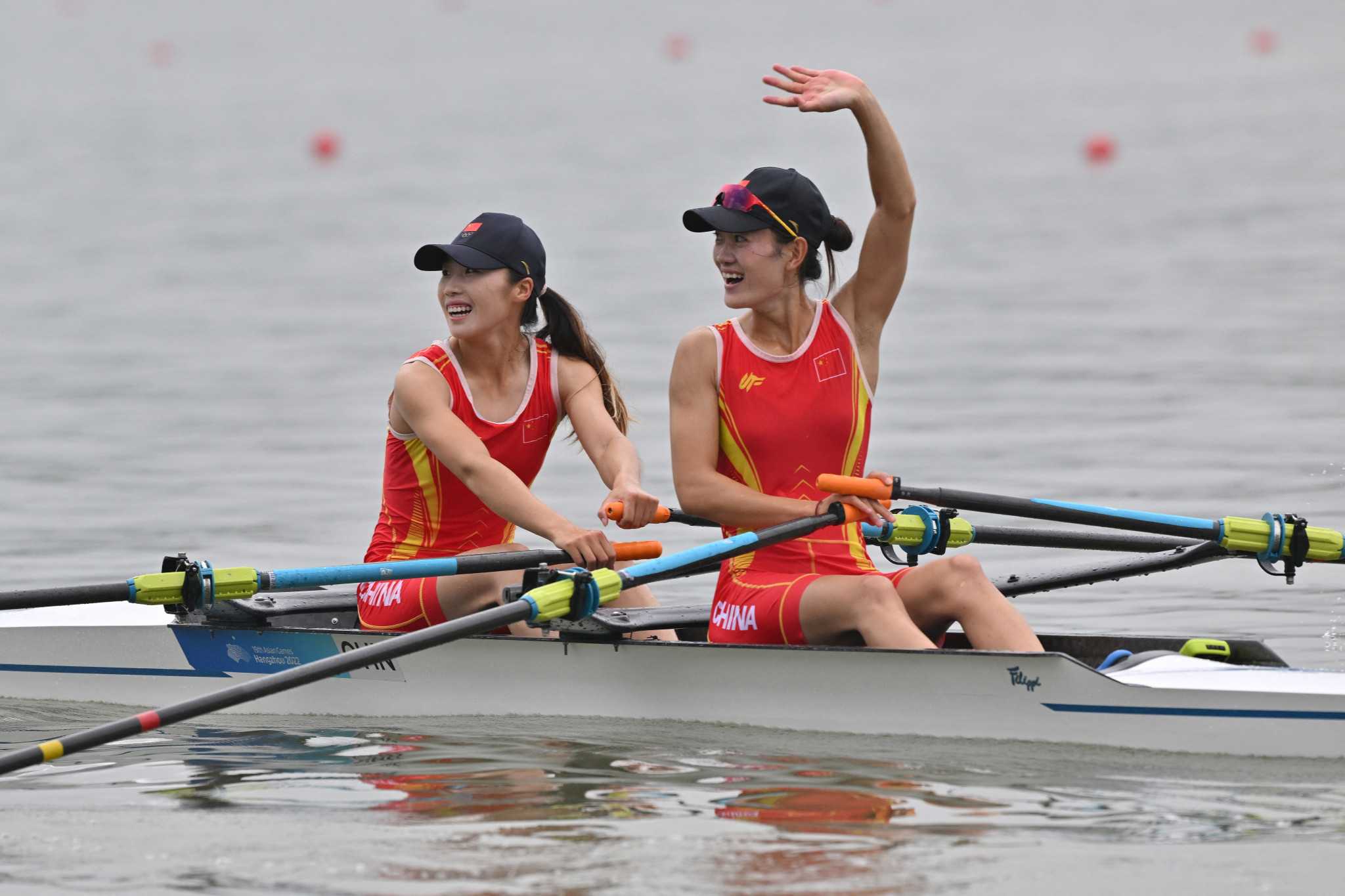 Zou Jiaqi, left, praised the raucous crowd for willing her and Qiu Xiuping to the finish line ©Getty Images