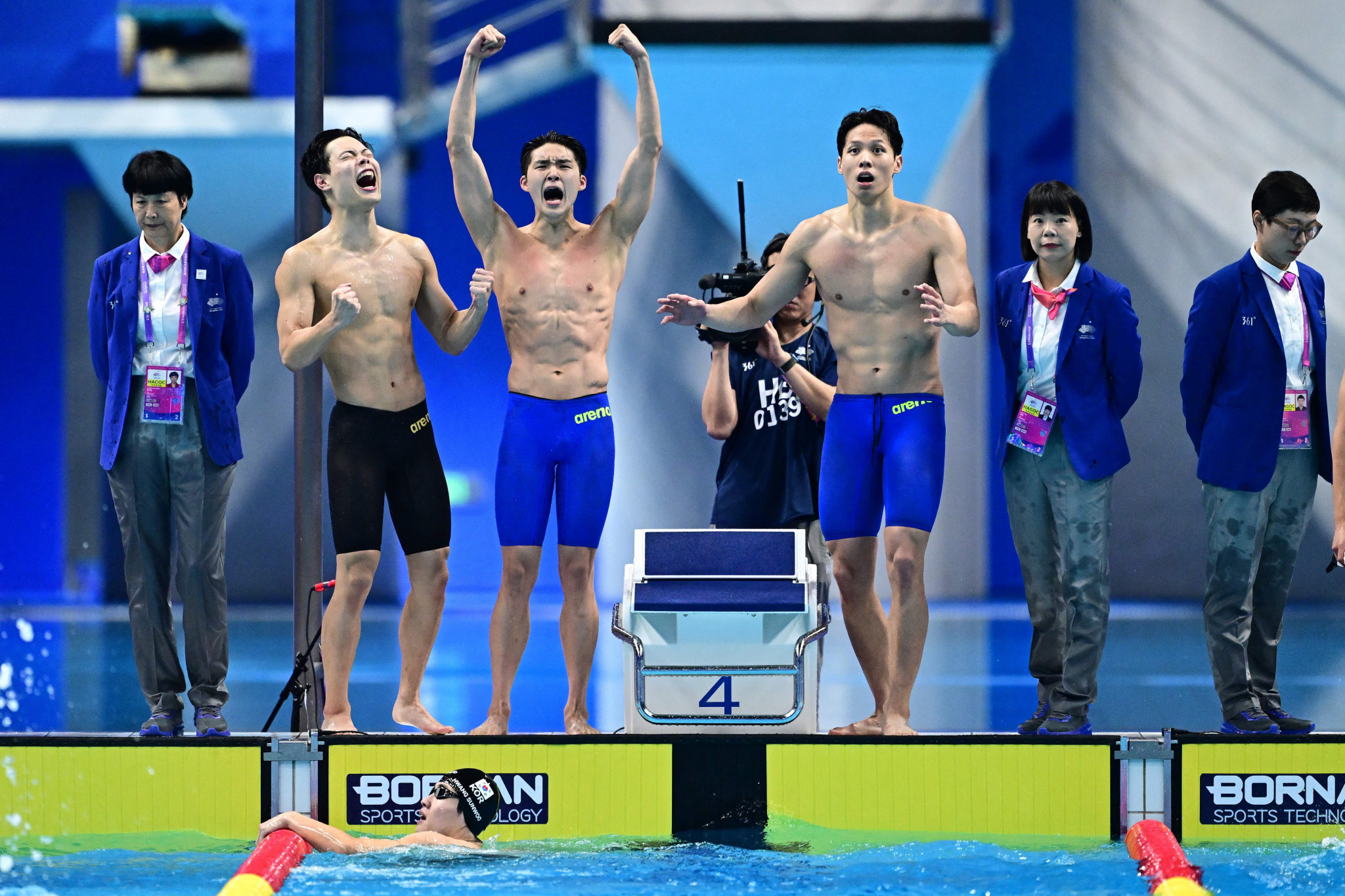 Members of the South Korean team celebrate after winning men's 4x200m freestyle relay gold ©Getty Images