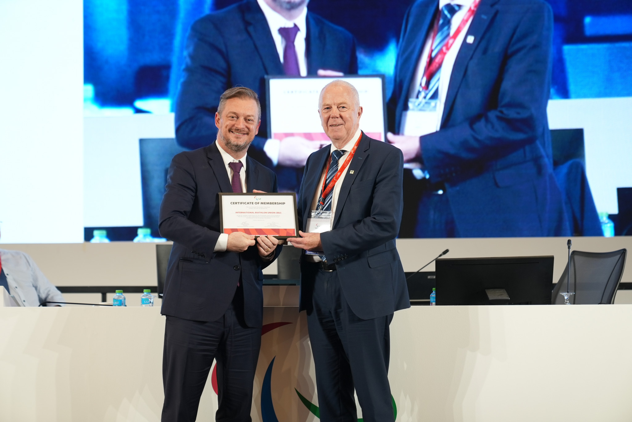 IBU President Olle Dahlin, right, declared ratification of its membership had produced 
