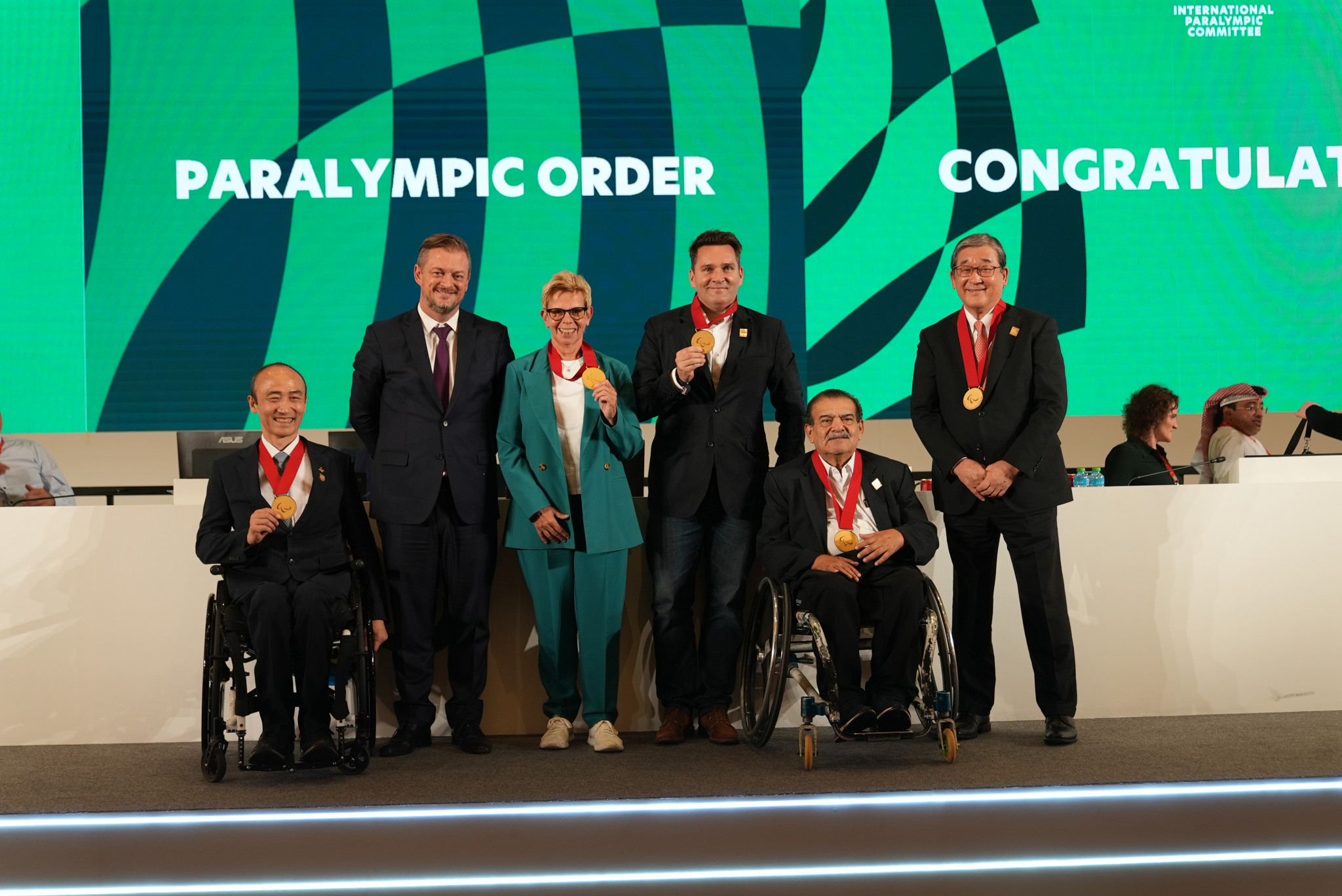 IPC President Andrew Parsons, second left, presented the Paralympic Order to this year's recipients and those who received the honour virtually in 2021 ©IPC