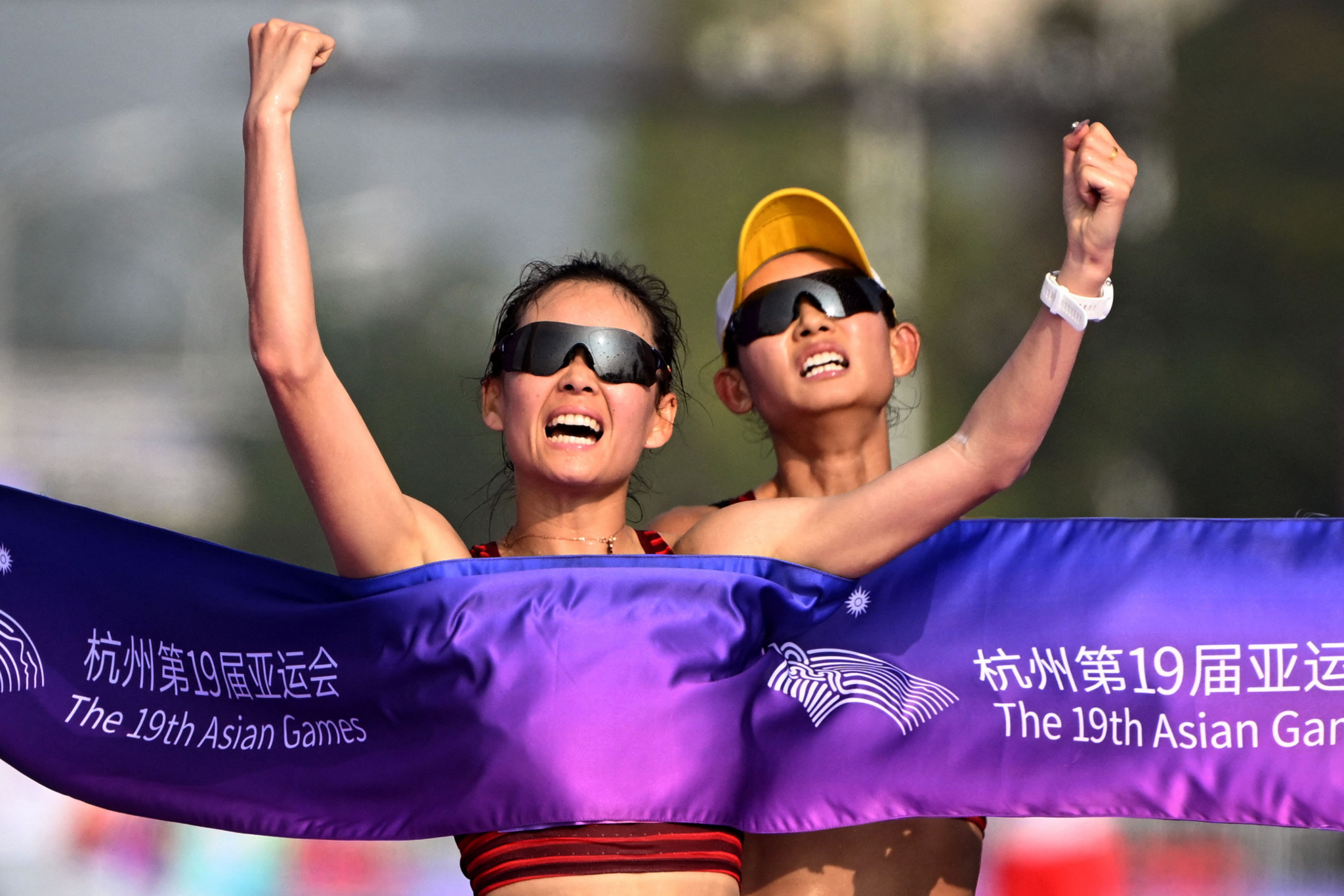 Athletics events made their first appearance today and saw Yang Jiayu, left, pip her compatriot Ma Zhenxia at the line for race walk gold ©Getty Images