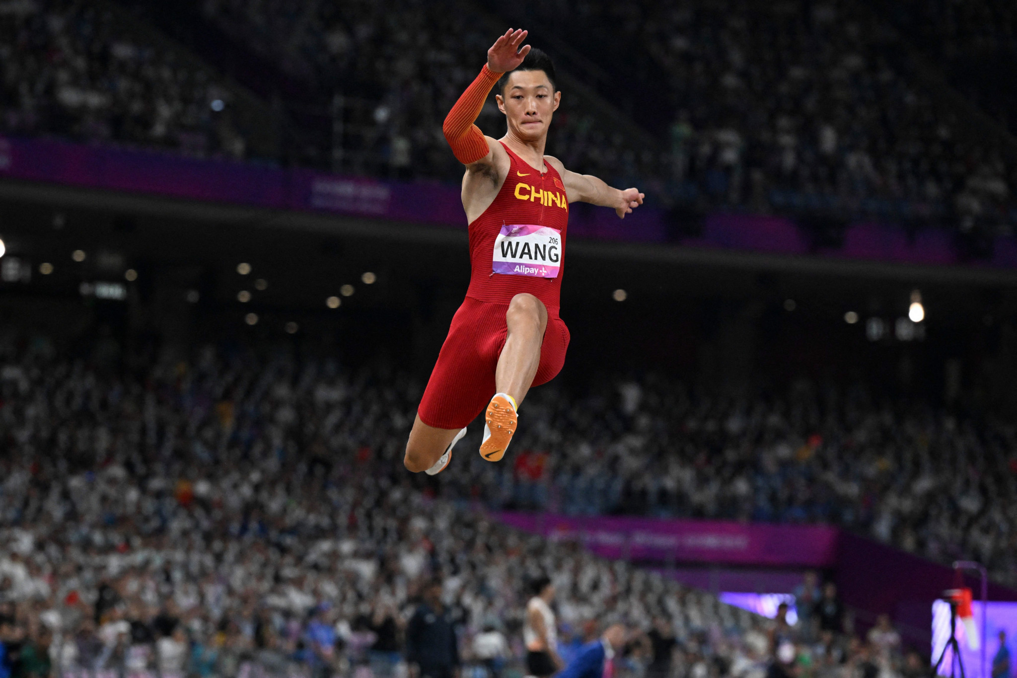 Wang Jianan left his best leap until last to snatch the men's long jump title ©Getty Images