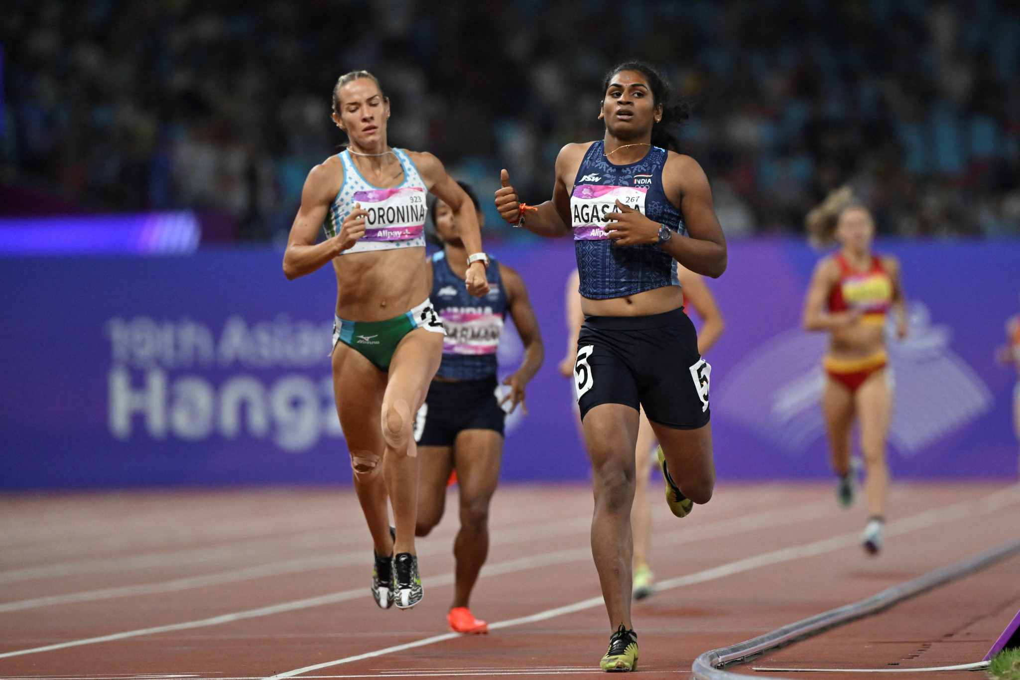 Nandini Agasara, right, won the heptathlon's 800m to clinch the overall bronze medal ©Getty Images