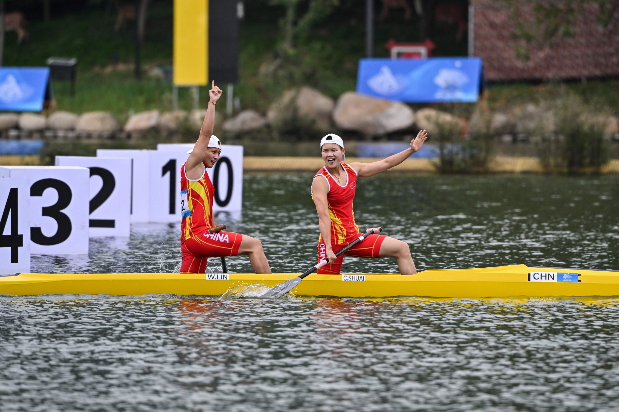 Lin Wenjun, left, sealed her second gold of the day in the women's canoe double 200m final with Shuai Changwen ©Getty Images